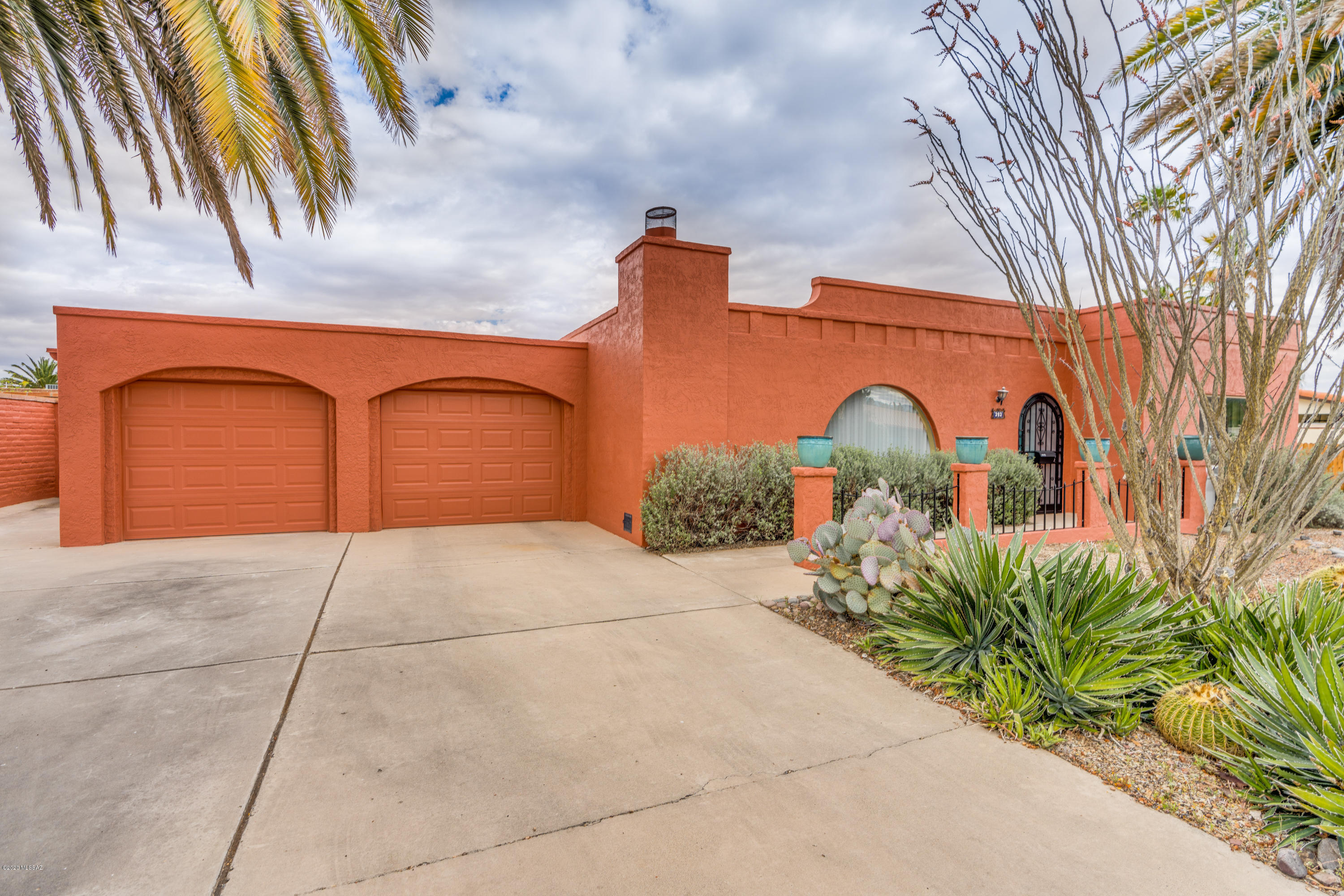 Charming southwestern bungalow located in the heart of Green Valley. 2 BR 2 BA home in Fairways neighborhood. Kitchen with stainless appliances, Spacious living room with gas fireplace, dining area adjacent to kitchen. All hard surface flooring -- tile in kitchen and AZ Room, concrete floors elsewhere. Expansive, multi-purpose Arizona Room with several glass sliders offering plenty of natural light and to enjoy the outdoors. Large, low care back yard and plenty of privacy. Recently enclosed 2 car garage with additional golf cart parking pad next to garage. Laundry room with storage. New HVAC and water heater 2017. Close to Country Club and Haven golf courses and GVR East Center. Low HOA fee.