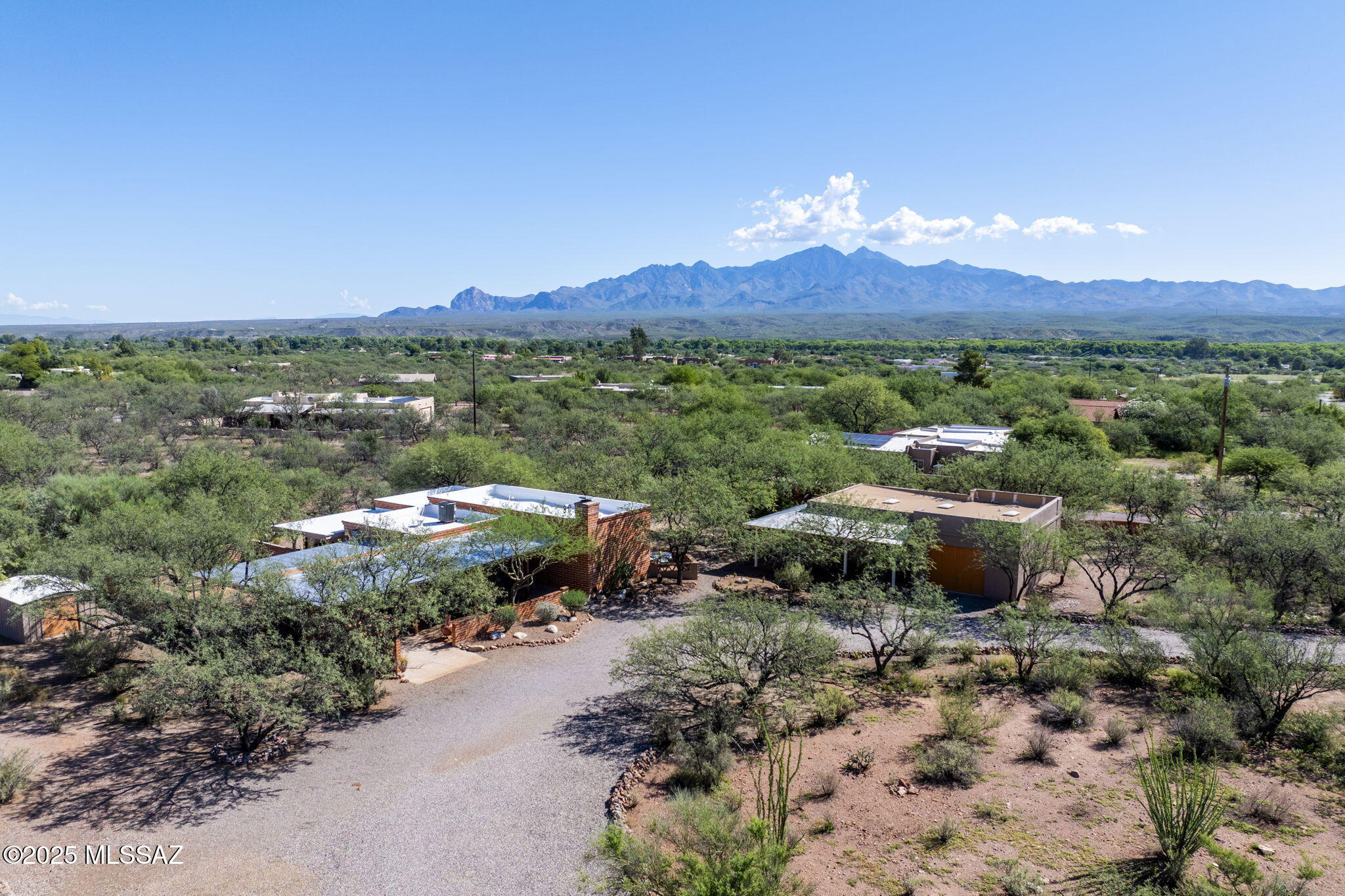 Handsome Fired Adobe Territorial Home on over 1.5 acres in Tubac. Open plan with spacious rooms and lots of natural light. From the open beam ceilings to the kiva fireplace and pretty Mexican tile, the home has that Tubac style that people love. Outdoor living spaces abound with comfortable sunny or shady spots for any time of day. 
The Garage is a huge over-sized space with a shady porch, room for 3 vehicles, access from both sides,  extra tall ceiling with 3 skylights, and space for storage and work. There is a large circular driveway with lots of parking. No HOA. Seller is a Licensed Real Estate Agent in Arizona.