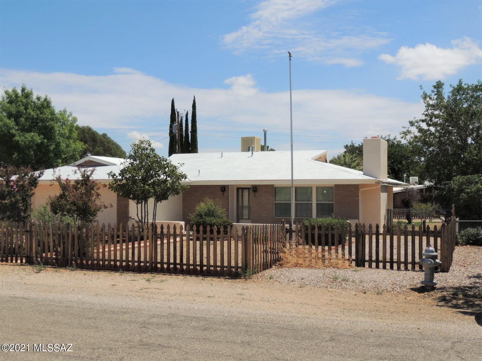 Great home in Sunsites, features 3BR/2Ba, large rooms, attached two car garage with shelving for storage. A fireplace to keep you cozy on those chilly winter nights. Large back yard backed up to alley, fenced with chain link for your furry friends. A pear and peach tree full of fruit. A walled front patio with a beautiful view of the famous Cochise Stronghold.
