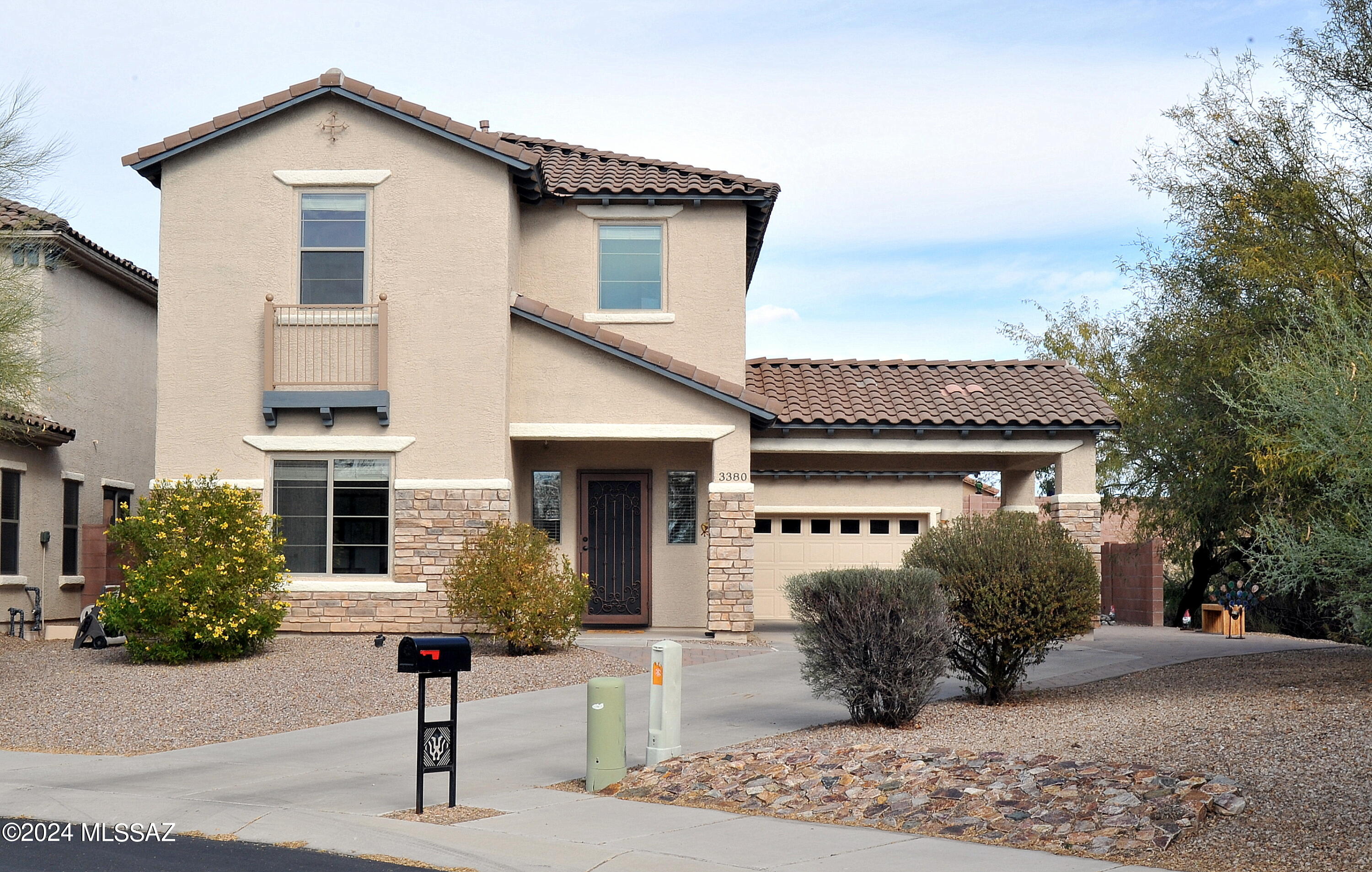 Come and see this beautiful 4 bedroom + loft, 3 full bath house in the gated community of Tangerine Crossings! The Interior and Exterior has been recently painted. All New LG S/S appliances, including washer and dryer, new carpeting, new light fixtures, new blinds. 
One full bath and bedroom downstairs.Large balcony from Primary Bedroom with wonderful mountain views. Truly an entertainer's  back yard with artificial turf, pavers, and raised garden beds. A two car garage with a covered carport that is next to a wonderful open space. Come and see this great home!
Please ask your agent for details about a VA Assumable Loan at a very low interest rate.