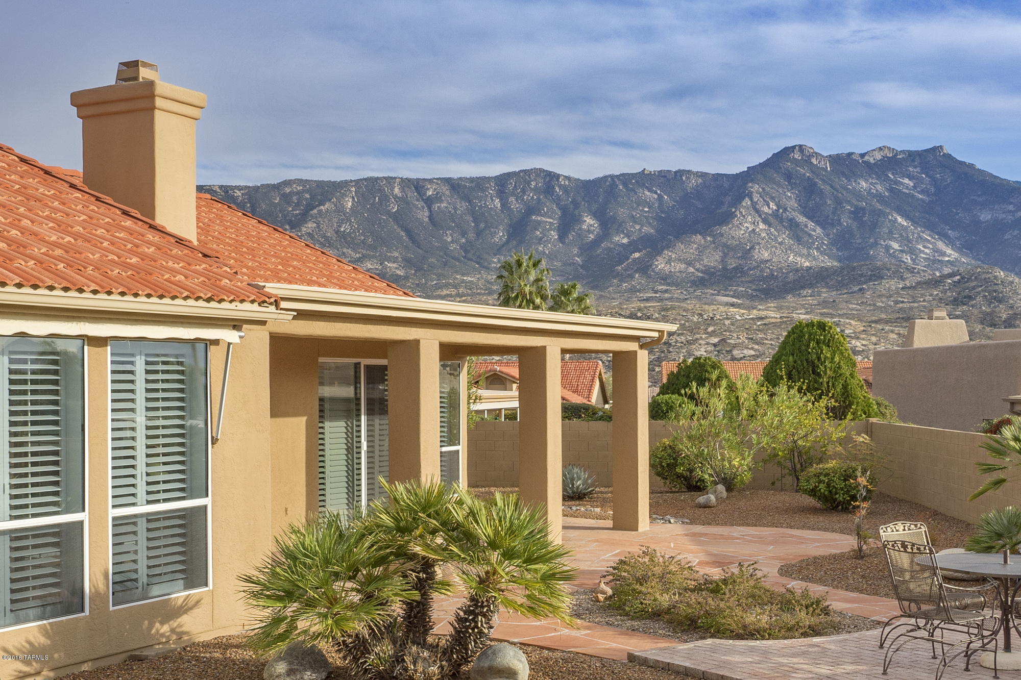 Never before on the market! A beautiful courtyard beckons you into this immaculate Barcelona model with guest casita & gorgeous Catalina Mountain views on a large lot. You will love the thoughtful upgrades including a double sided fireplace, all window coverings, large garage with 2 car spaces, golf cart space & a work area.  Kitchen boasts upgraded kitchen cabinets with pullouts, solid surface counters & stylish backsplash, bay garden window, double ovens and twin Fisher & Paykel drawer dishwashers. This floor plan has lots of flexibility, abundant storage, and absolutely no carpet- just easy care neutral ceramic tile & a very pretty wood laminate. A soft neutral paint palette makes your own designer touches a breeze. Outdoor spaces are well sized yet low care, & feature mountain views.