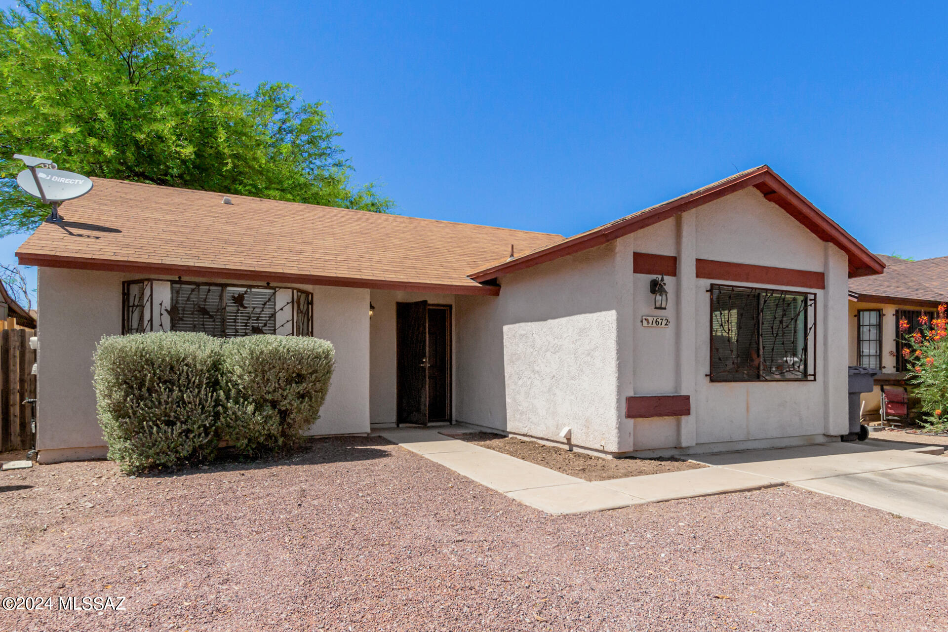 Look no further! This inviting 2-bedroom home welcomes you with vaulted ceilings and a soothing color palette. The interior features tile flooring throughout and a spacious living room perfect for relaxing. Enjoy family time in the large family room designed for making memories. The kitchen boasts ample counter space, white cabinetry, and built-in appliances. Each bedroom offers a cozy retreat with its own closet and bay window, ensuring a restful night's sleep. Outside, a serene backyard awaits with a covered patio, sitting area, storage shed, and a shade tree. Don't miss out. Make this home yours today!