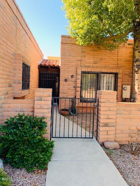 Beautifully established Townhome in 55+ Adult Community. Large kitchen, beautiful wood shutters throughout this home, full length AZ room facing West. Mature landscaping but very low care. Enjoy mountain views and especially our amazing sunsets from your back patio. Participate in many activities within the community. You will love coming home or just staying home. Move in ready..