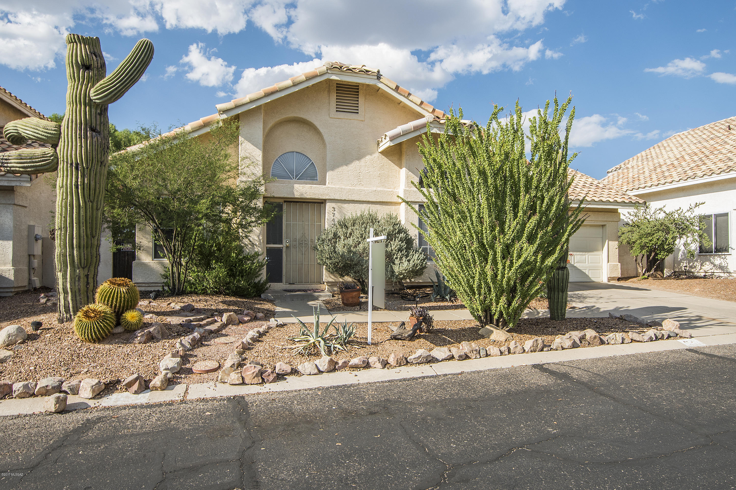 This well maintained home sits on a premium lot in the desirable community of Park Lane.  The backyard faces north to undeveloped space, and the views are exceptional.  The house feels large with vaulted ceilings throughout, and is well appointed with ceiling fans and plenty of natural light.  Kitchen has been upgraded with granite tile countertops.  The backyard has vehicular access from the alley, and a shaded rear patio and side barbecue area.  Community pool is just half a block away.  This neighborhood is close to all of the shopping and entertainment in Tucson's North West side.  Tenant will be out by September 31st.  Shown by appointment only.