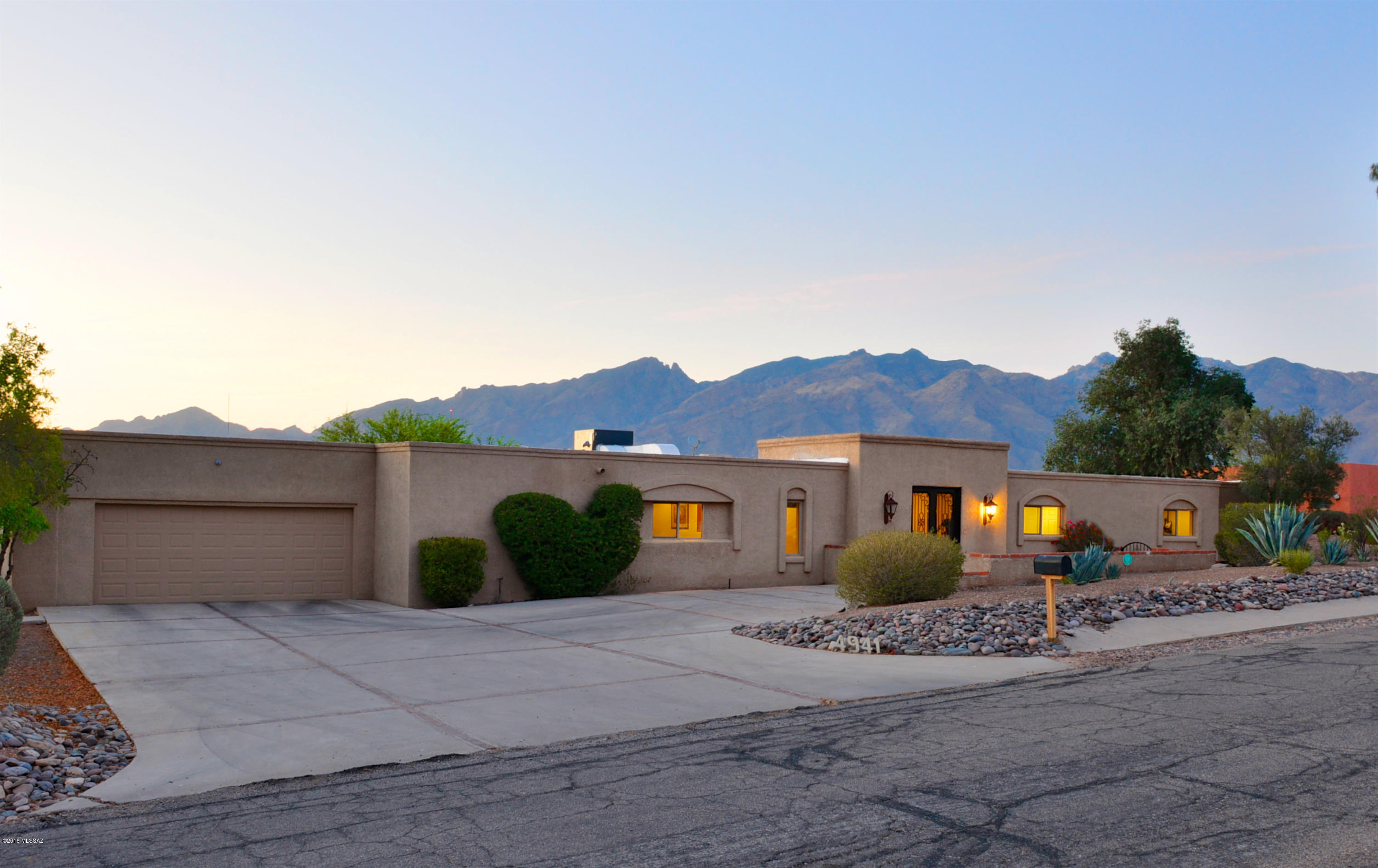 Foothills resort! Back yard faces NW and offers great mountain views. Large pool and spa. Beautiful double doors by Chavez. Grand kitchen includes large granite island with prep sink. Dacor gas range, Viking refrigerator, SS appliances. Abundant cabinets with pull outs and soft close drawers. HUGE walk in pantry. Family room off kitchen overlooks dining room with wall of windows. 3BR/3BA, den & office in main house. Guest house - 1BR/1BA, eat in kitchen w/SS frig, and it's own mini split. Generous master suite has great mtn views, walk in closet & bath w/separate shower, jetted tub. All baths enjoy executive height vanities. Beam ceilings, newer cabinets, new roof, newer HVAC & water heaters! Lots of parking for guests. Den has closet - could be 5th bedroom.