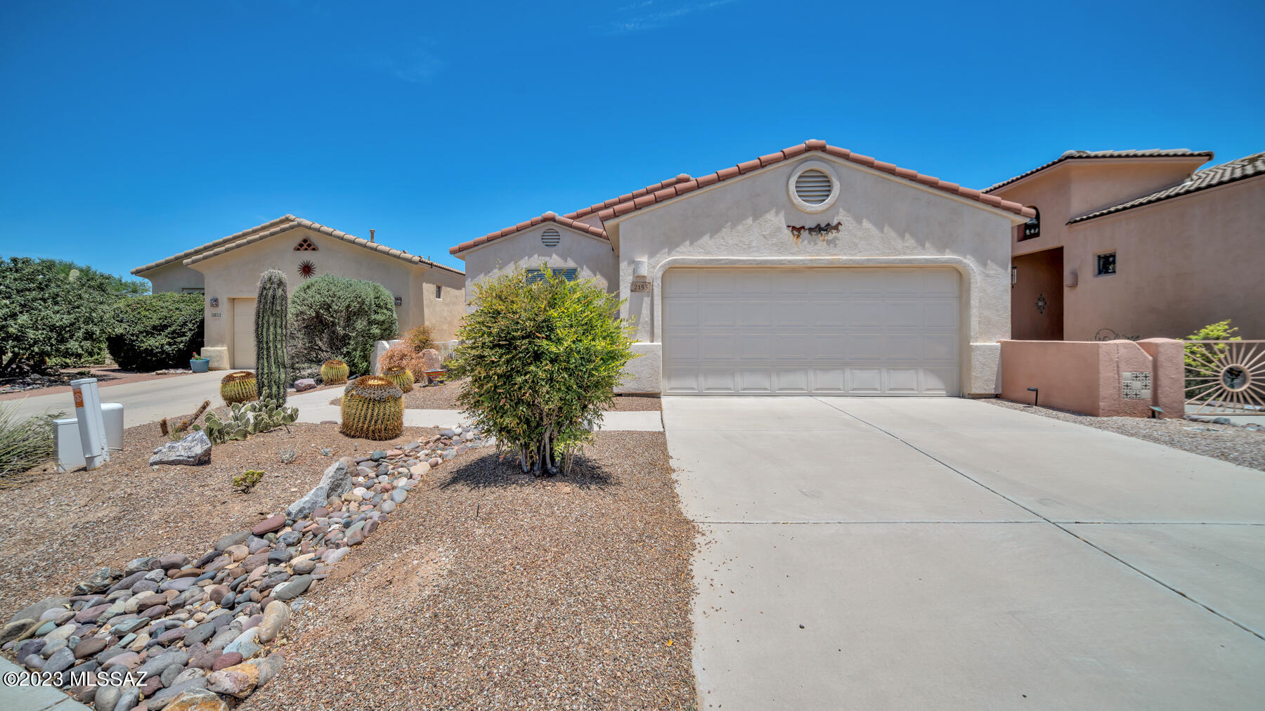 Home Sweet Home. Open Concept.  Enjoy large windows and high ceilings. The kitchen is open to the spacious living room and features beautiful cabinets with plenty of  storage. This split-bedroom plan offers flexible living areas.  There is a built-in desk and walk-in closet in the primary bedroom.  An attached two-car garage is oversized with plenty of room for storage.  Relax in the private courtyard in front area or beautiful private back yard with a large, paved patio and some mountain view.  This community has its own pool and spa  for residents and also includes Green Valley Recreation membership.  Golfers will appreciate the very close proximity of  courses. Includes washer, dryer and refrigerator. Furniture available under separate bill of sale.
