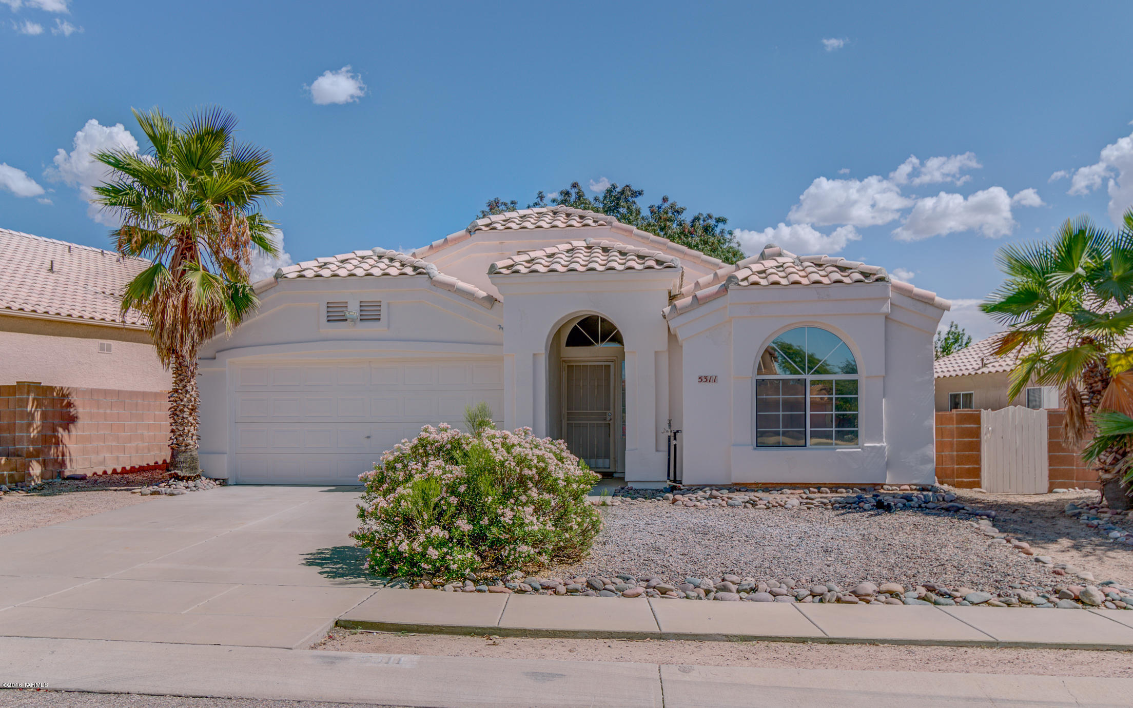 This three bedroom home is gorgeous!  It has been pampered and is ready for you to move in.  You're going to love all of the details from the tile roof to the gorgeous entry way.  The floor plan has terrific flow and the open concept is going to bring this home to the top of your list.  There's no carpet in this house, a desert dweller's dream for easy care and maintenance.  The kitchen is well equipped with plenty of storage and counter space.  You're going to love the granite counter tops!  The entire home has been freshly painted.  The garage is going to keep your vehicles in the shade while the bay windows throughout the home are going to allow for extra dimension and light.  You are going to melt when you see the master bedroom and bath.  Don't hesitate to see this one today!