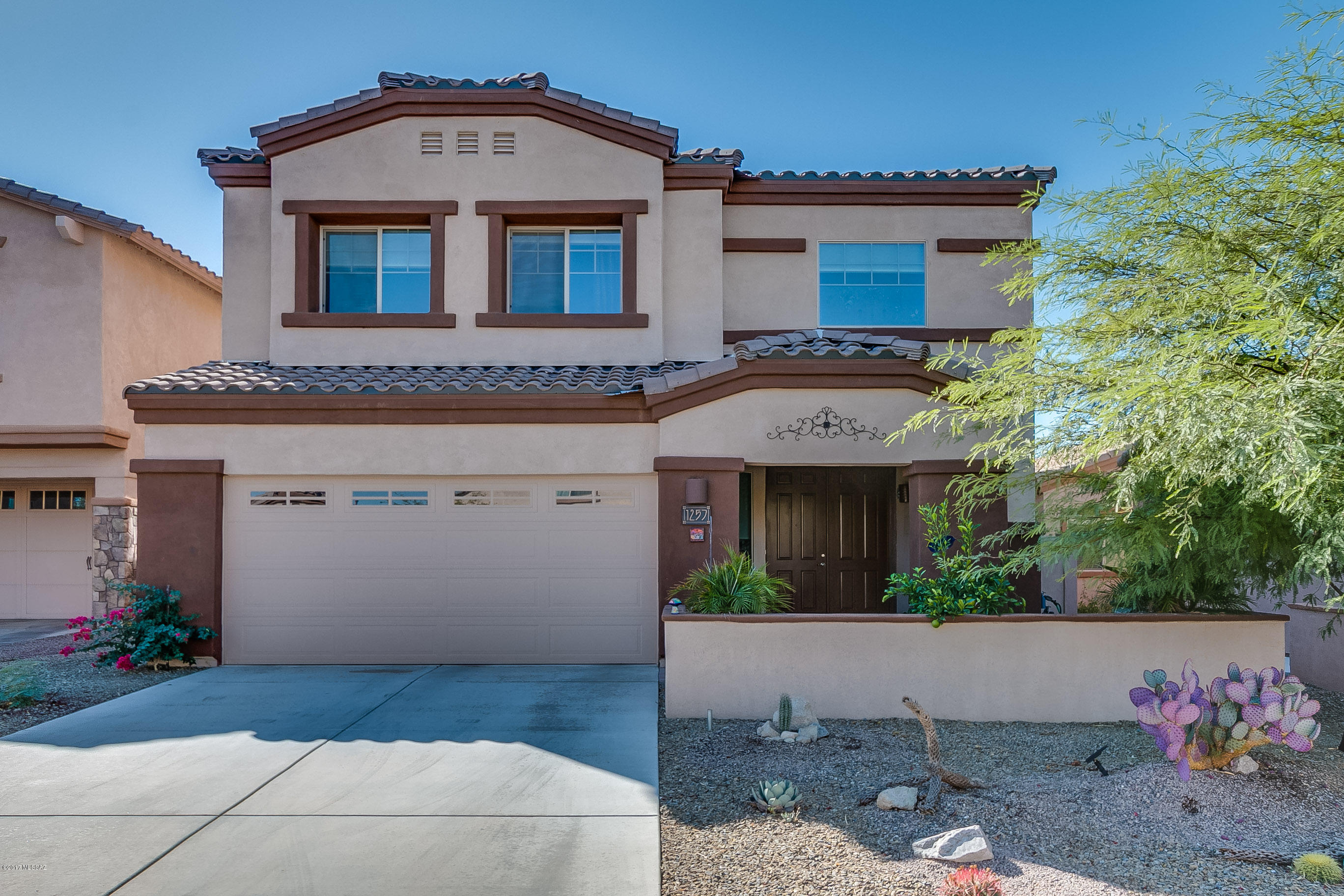 This impeccable home located in the community of Rancho Vistoso  features 5BD/3BA+Loft (2,980sf) & backs up to common area for privacy, views & tranquility.  No neighbors behind! Enter this lightly lived in home home & find a open modern floor-plan. Too many upgrades to mention. Open concept chef's kitchen w/granite counter-tops, SS appliances, back-splash & plenty of storage. Spacious master suite with two walk-in closets, luxurious bath and balcony access. Great room opens to kitchen/dining area for modern living. Separate loft area. The large fully enclosed patio is ideal for outdoor living & entertaining. The private fenced wide back yard with paves and landscaping offers supreme privacy and views. This home is a must see and will appeal to the most discriminating buyer! Views.
