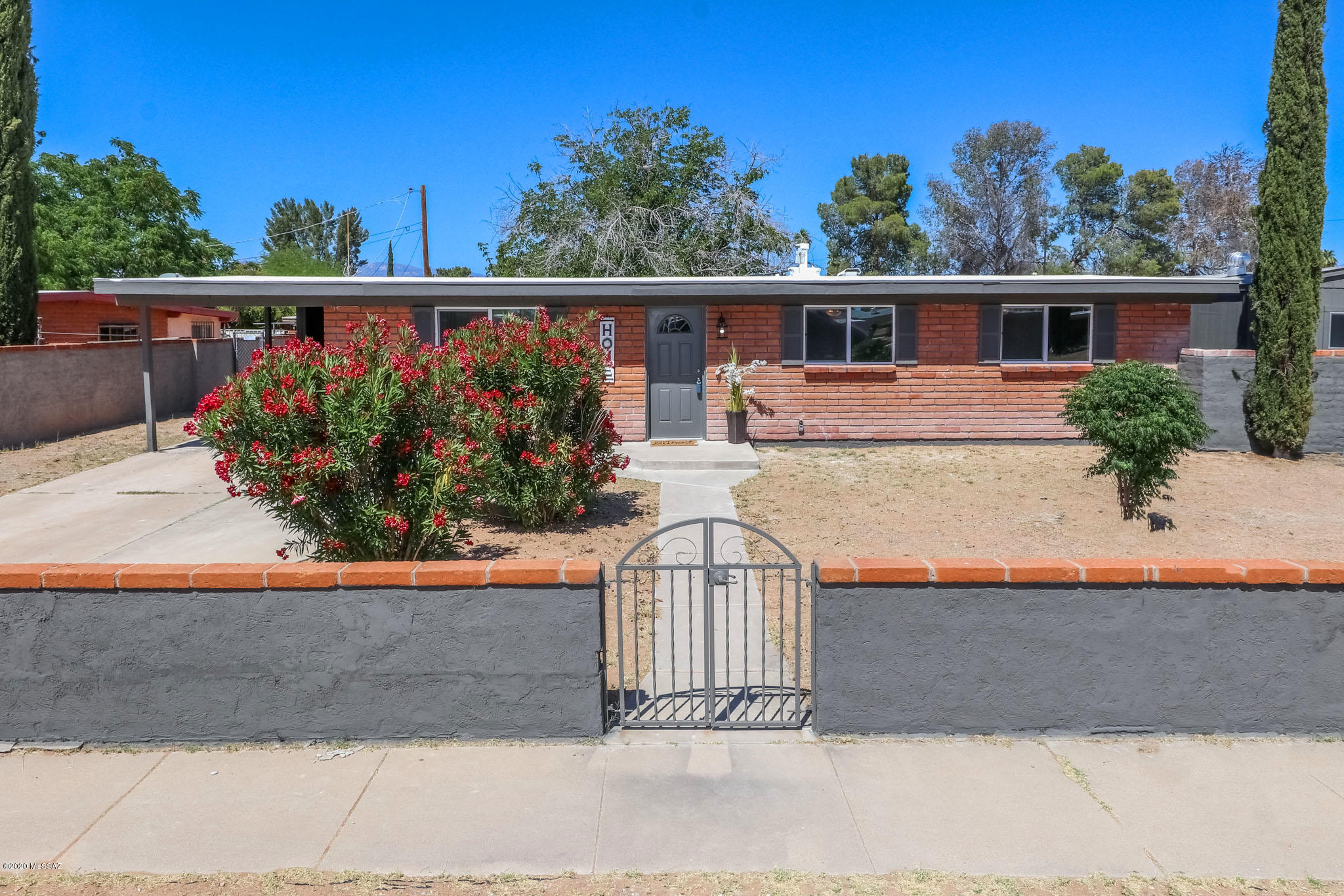 Beautifully Remodeled Ranch Style Home w/ amazing upgrades available in South Tucson!  3 Bedroom. 2 Bath, Large back yard w/ a Huge storage and mature trees. All New Windows, Newer HVAC, New Flooring, New Kitchen with STAINLESS Appliances New Bathrooms New Paint inside and out !  Roof maintenance and recoated. New fixtures throughout!  This is a MUST SEE   Excellent location & rare to find, fully enclosed yard corner lot Large. Close to Schools, Community Park w/ Pool, Basketball and ball field. Quick Access to the Loop, shopping, restaurants and the I-10.