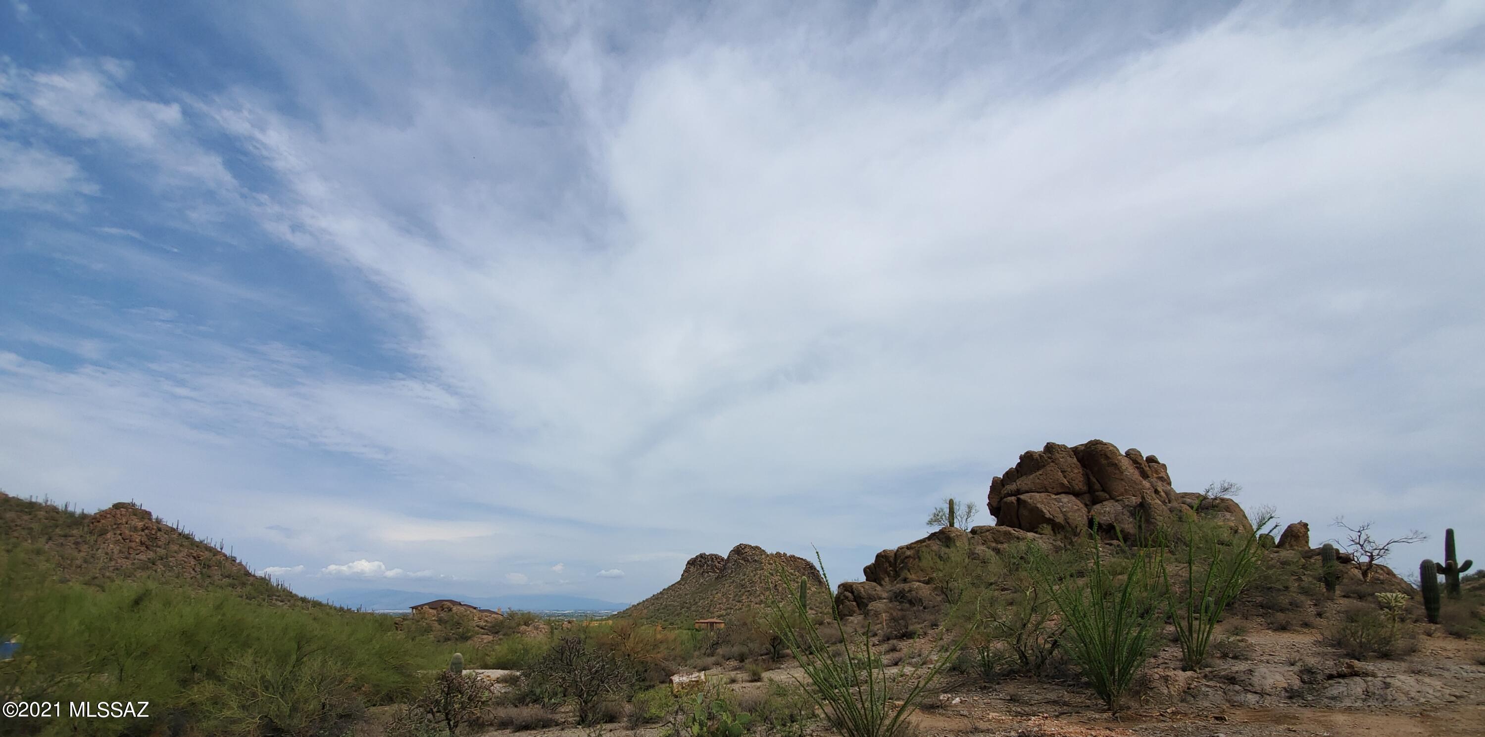 Southwest area 3.41 acres Land Amazing Mountain and City views with Cactus Saguaros, ocotillos and Rocky peaks surrounded with Custom homes , Land is ready to start building your dream custom  house, very private and quite area with driveway to access the property. City water available and TEP Electricity at lot line.