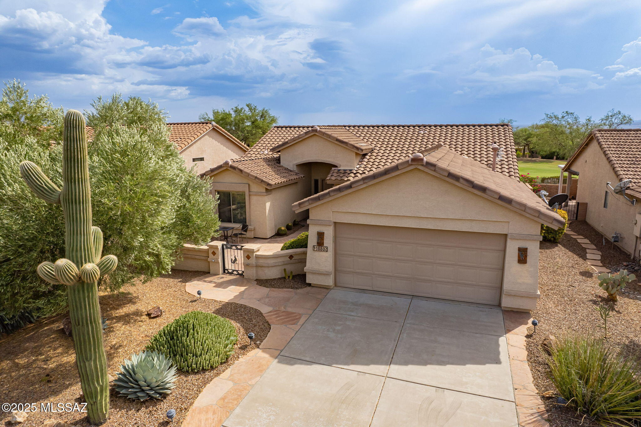 GOLF COURSE LIVING AT IT'S BEST! Here is the perfect winter retreat or full-time home on the 5th fairway of the Quail Course in the gated, Active Adult Community of Quail Creek.  Enjoy this fabulous, move-in ready 1569 sq. ft. Oakmont model featuring a 2BR, 2BA, den, and 2-car garage, on the golf course and very close to all the Quail Creek amenities. Primary suite has a dual vanity, upgraded shower, and walk-in closet. Den has custom cabinetry, w/ doors that offer extra privacy for use as an office or 3rd bedroom room. Kitchen has quartz countertops, stainless steel appliances, breakfast bar, and pantry. Enjoy breathtaking mountain views, sunrises and sunsets from the private, large south-facing rear patio. HVAC replaced in 2022. Furniture available on SBO