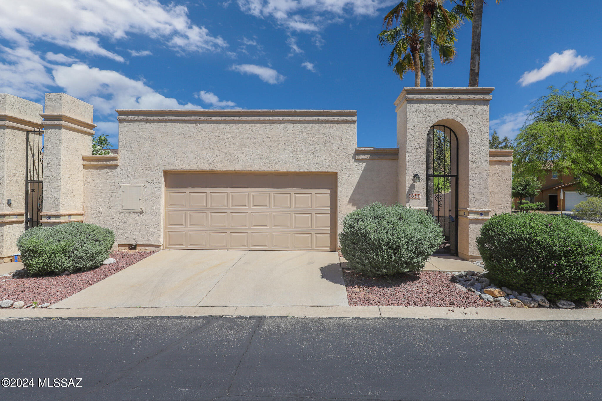 Welcome home! This cute and contemporary NW side gem is move in ready! Open living area with vaulted ceilings gives it a spacious feel. Neutral color scheme, lots of natural light, and ceramic tile throughout! Kitchen features two tone cabinets, pull out shelving, and gas range. Both bathroom showers/tubs have been completely re-tiled and re-plumbed. Fresh exterior paint! All windows and sliding glass doors have been replaced with dual pane Milgard. Newer water heater! Gated entry with intercom and buzzer system. Backyard has plenty of room to relax, while  low maintenance. See attached doc for more upgrades! Community amenities galore including junior size Olympic pool, wading pool, spa, fitness room, tennis, racquetball, horseshoes, softball field, basketball courts, playground, & more!