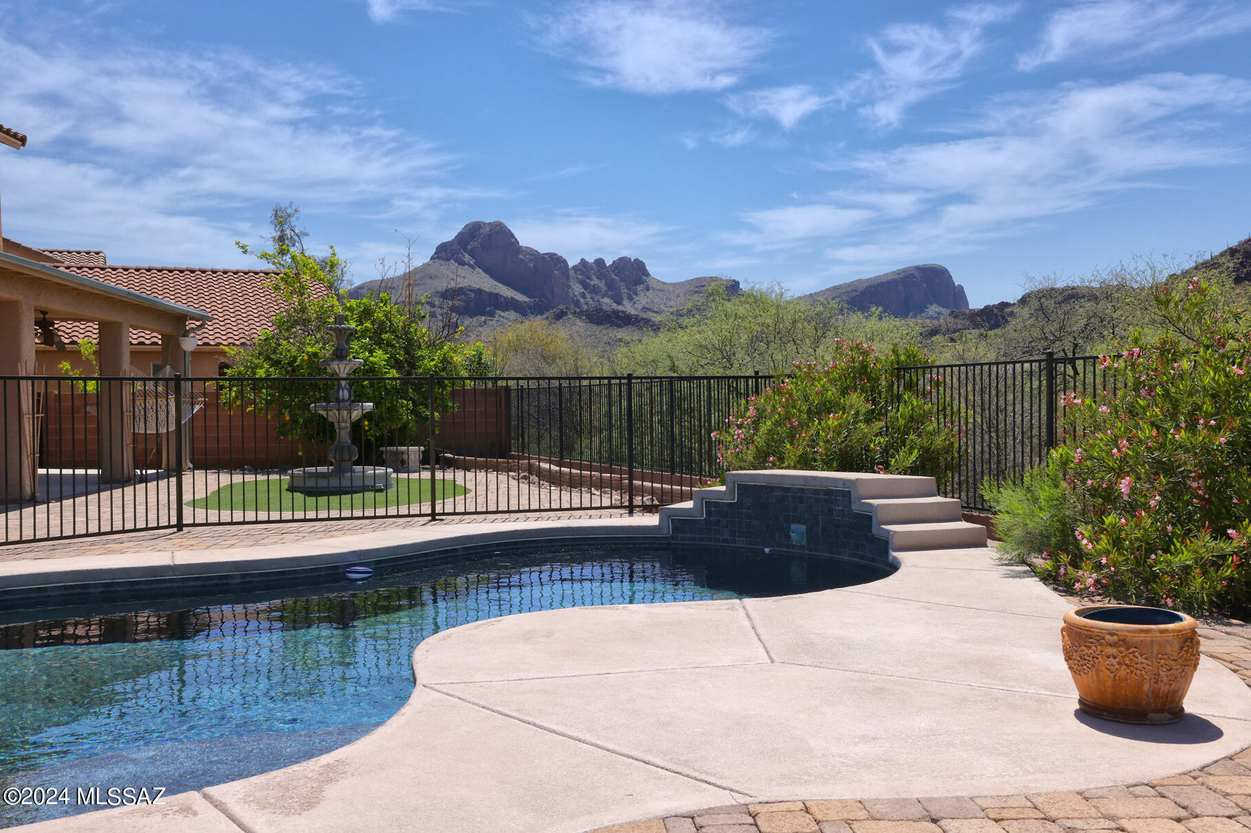 This lovely home offers the best of desert living w/beautiful touches at every turn. The backyard is an intimate retreat offering a pristine pool w/baja shelf, deep covered patio, beautiful fountain, turf and sitting area perfect for soaking up the sun & enjoying stunning mountain views and open space behind. Step inside to find an open floorplan that blends style & comfort. Enjoy the many living areas, including the entry family room, light filled living room and upstairs loft/sitting room. The spacious primary suite has a separate shower, soaking tub and deep walk-in. Extra bedrooms can also be used for fantastic offices with lots of natural light and big mountain views.  Right around the corner from the neighborhood park and easy access to I-10 and all your shopping needs.