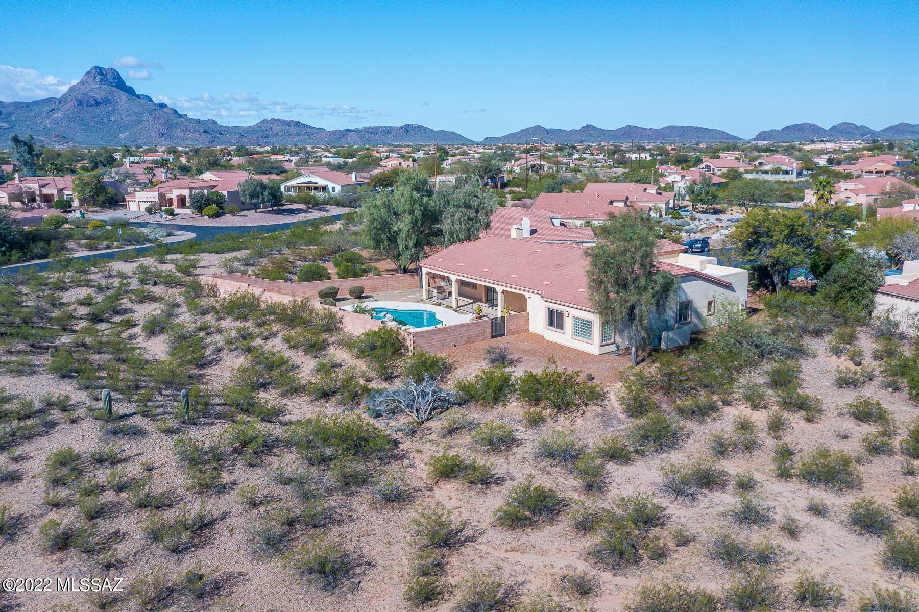 Contemporary home on large cul-de-sac lot. Neutral colors and an amazing flexible floorplan. Enjoy Views from the sparkling pool and extended back patio. Sunsets of Sombrero Peak and Rincon mountains to the East. The open kitchen and family room will be the hang out area!  Flex rooms for dining, office, formal living room and an amazing master retreat with a 3 sided fireplace and lots of windows for light. Available for quick closing and move in. Don't miss all the extra storage and built-ins. Need a designated room for hobbies, work etc.....this has it!