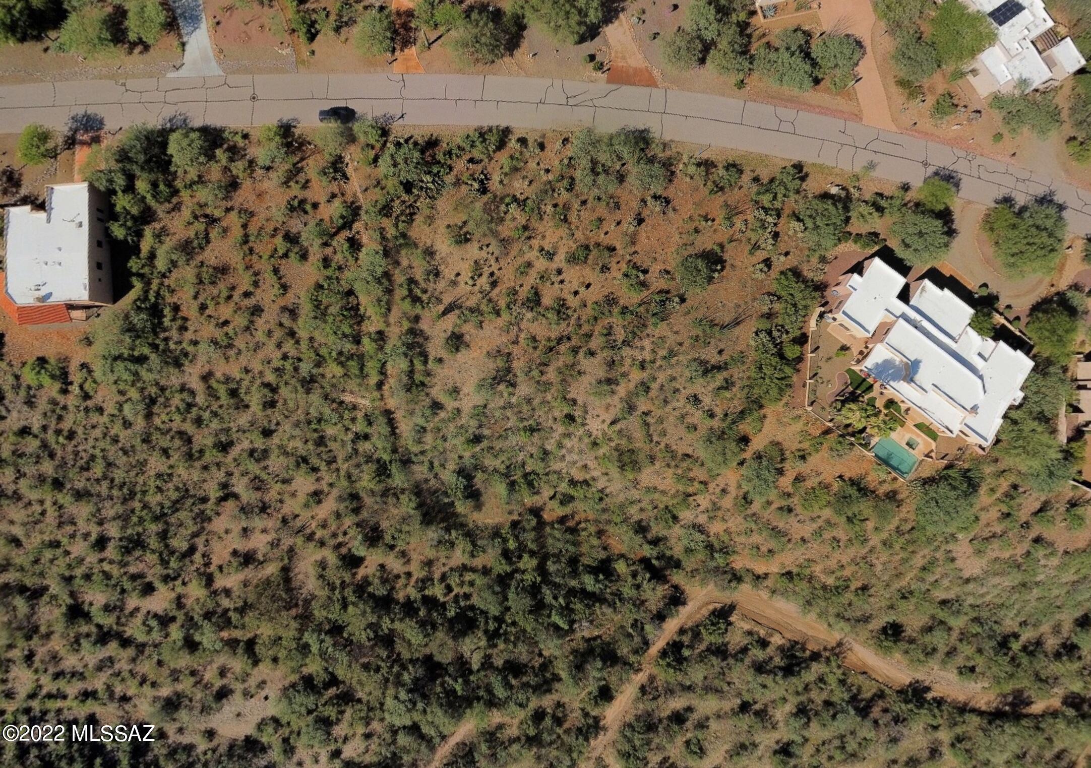 Build the custom home of your dreams on this level 1+ acre site with sweeping panoramic views of the Santa Rita Mountains. Adjoining a Common Area to the south, a wash to the east and adjacent to Santa Rita Experimental Range you'll appreciate the privacy and unobstructed views. Situated on a low traffic cul de sac street. Build the custom home of your dreams with your own contractor on your time & schedule. Utilities at the street include: sewer, water, electric, gas, cable, and phone. Nearby to the world-renowned birding paradise of Madera Canyon and the A+ rated Continental School.  All ages neighborhood. Option to join Green Valley Recreation with access to numerous social & fitness activities including pickleball, fitness centers, pools and more. EZ 30 min drive to Tucson.