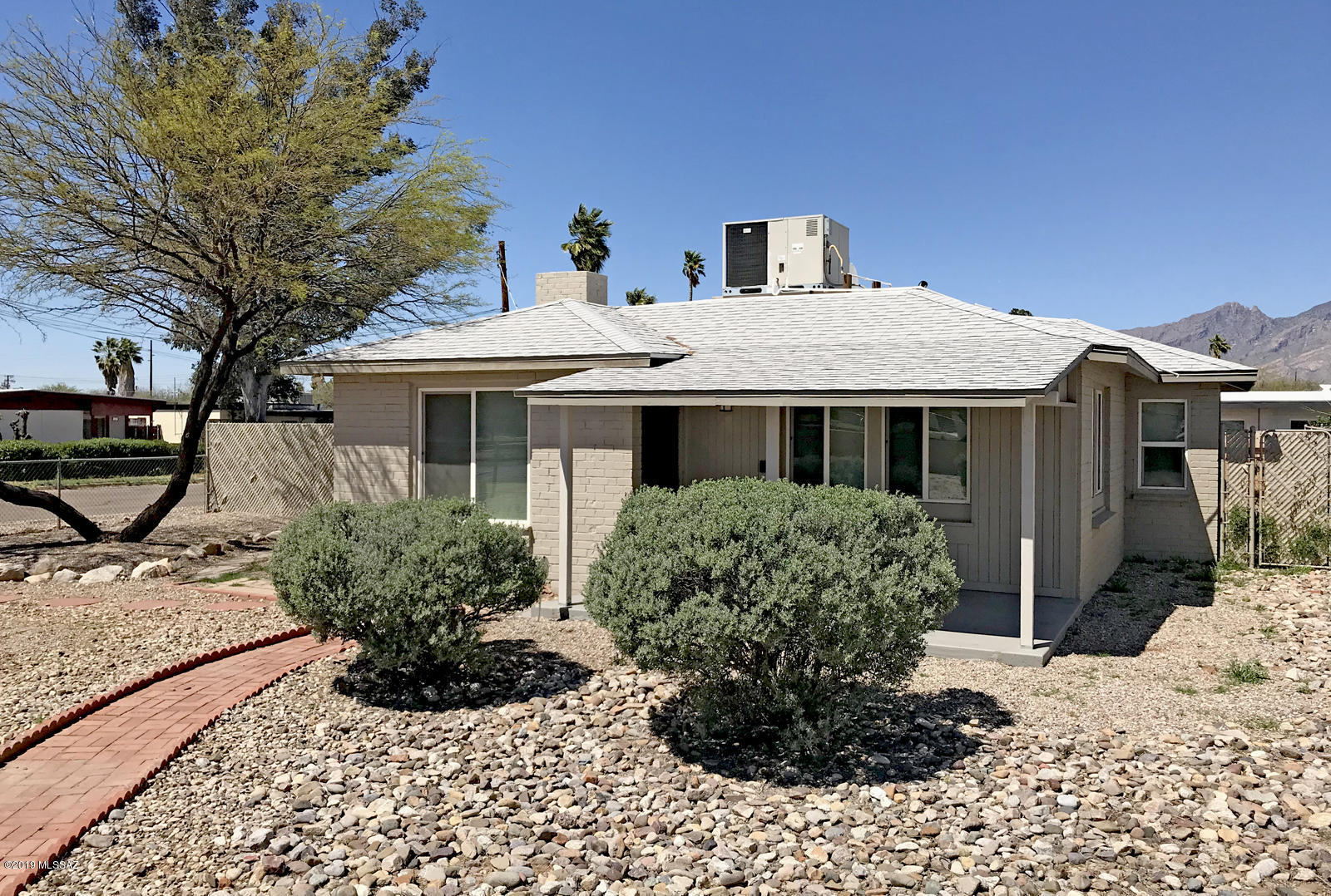 You're looking for a convenient central location with room to expand. But for now, you want something already done, you know, a nice solid home with updates. Well, here it is! Whether you want to downsize now or expand later, this R-2 zoned property has versatility for either. This is all the space you need with room to add an ample garden or maybe a Koi pond! Or both! Put this at the top of your tour list. This house has all the updates and conveniences you want.  A double lot has a fenced backyard with two gates. Home is near great shopping, restaurants, Tucson Botanical Gardens, just minutes from everything Tucson has to offer. This charming well thought out floor plan is waiting for you to move in. Come explore. Perfect for anyone, this home is ideally positioned to enjoy Tucson!