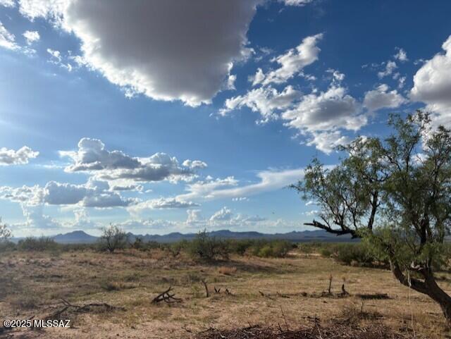 Discover the beauty of desert living in this prime vacant lot located in the peaceful Three Points area. Surrounded by wide-open mountain views, this property offers the perfect setting for your dream home or investment. Conveniently located near the local fire station, you'll enjoy peace of mind along with the quiet and privacy of rural living. Experience Arizona sunsets like never before, all while still being within easy reach of Tucson's amenities.