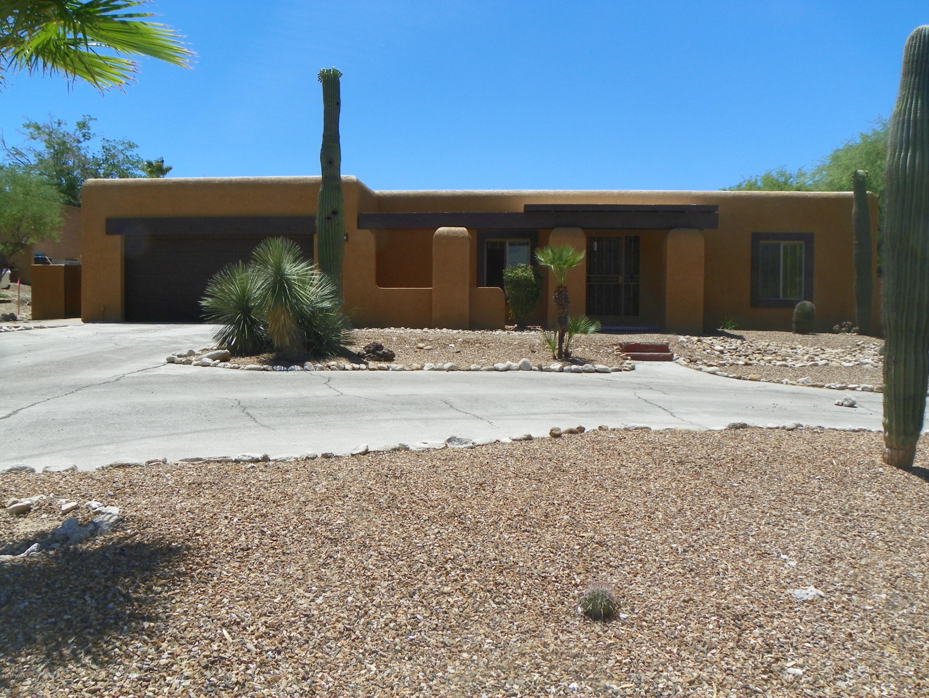Beautiful Santa Fe on a large .44 very private lot. Living Room, Great Room and Arizona Room provide an abundance of living and entertaining space. Beautifully updated kitchen, updated master bath. Very larger back yard with a sparkling pool for the warm summers.  Priced to sell and ready to move in.