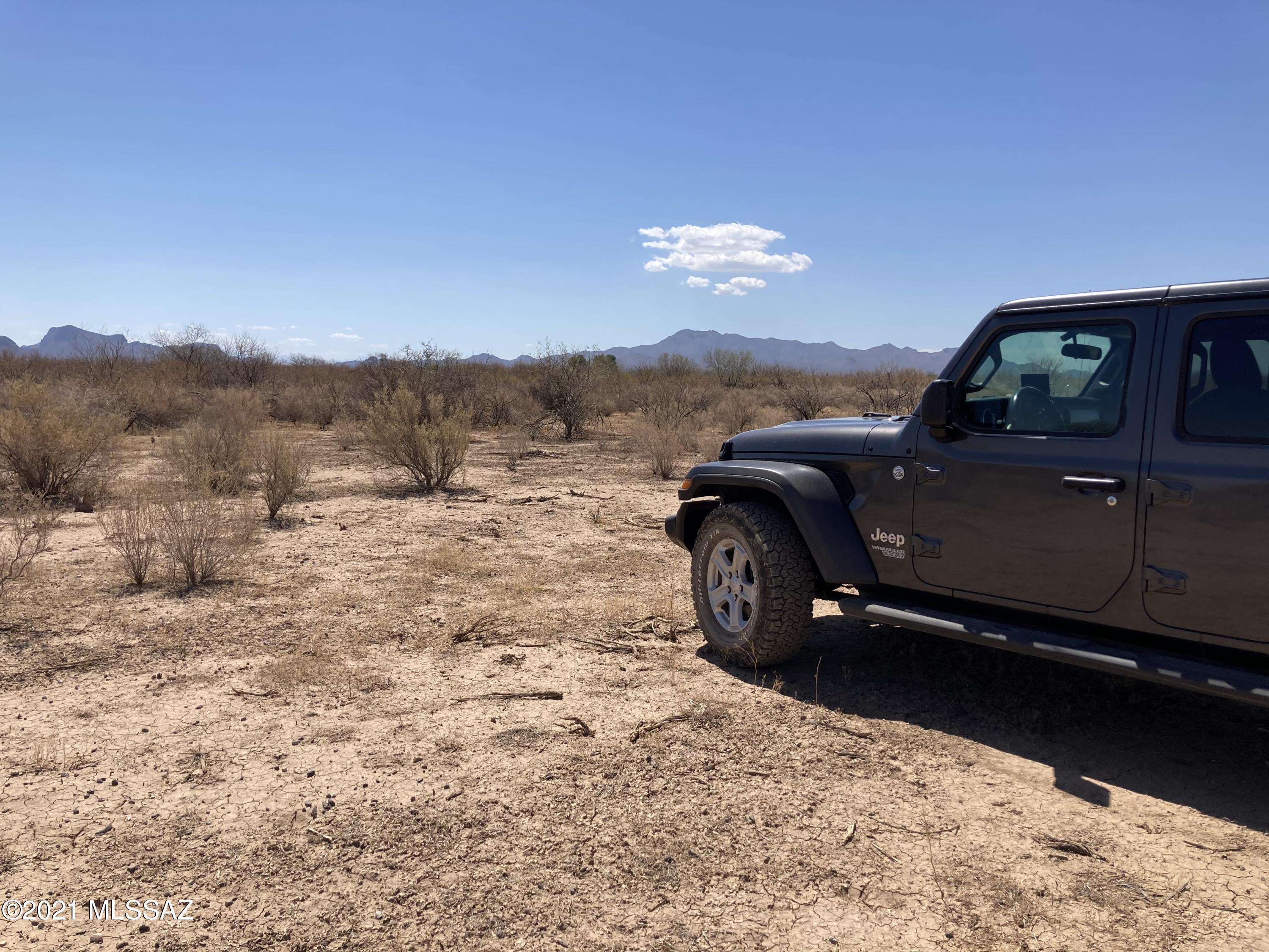 Electric within half a mile - Flat 5 acres - Access roads available. Marana School district with a great opportunity for rural property. Buyer to confirm zoning and utilities. Make an offer today!!