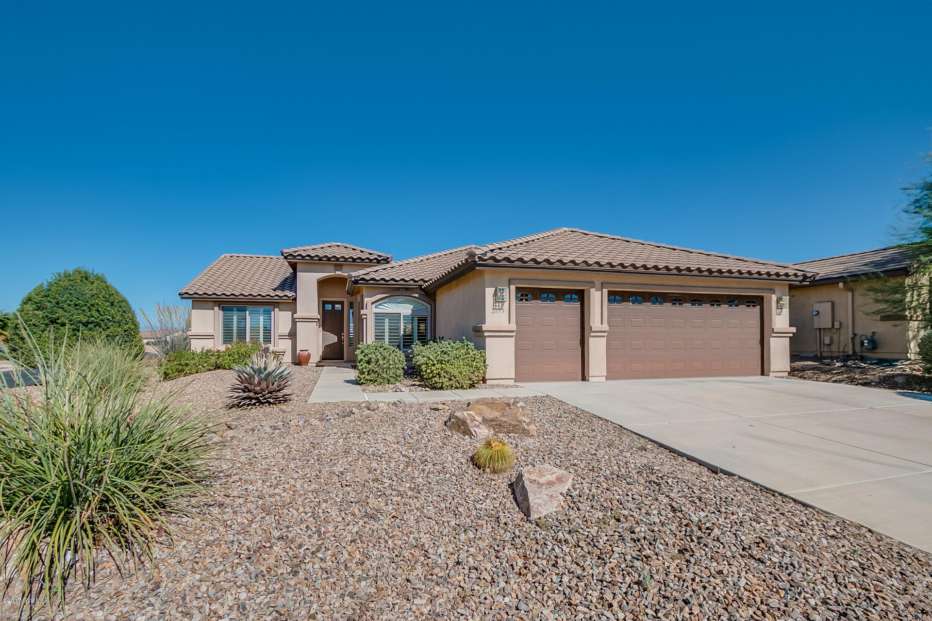 This is a gorgeous home on a large corner lot in the popular resort community of Quail Creek. The expanded Laredo offers 2006 Sq. Ft. of living space; two bedrooms, two bathrooms, and a spacious laundry room. The den has a double door entry, built-in corner desk with lighting and a Murphy bed. The home has attractive neutral 20' tile throughout with luxury carpet in the bedrooms, two tone neutral paint and plantation shutters. The kitchen has Granite counters, stainless appliance and an island. The three-car garage is extended offering lots of room for hobbies and storage. The back covered patio extends the length of the home and the back yard is very low maintenance allowing you ample time to enjoy all that the community has to offer. The homes beautiful furnishings and decorated  are available via SBOS so you can simply move in and enjoy.