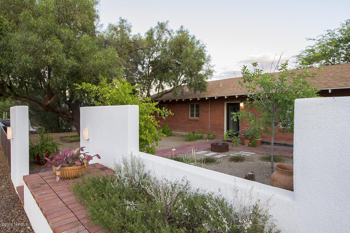 This lovely designer inspired Elm neighborhood home is close to downtown, UA and UAMC. Walkscore & bikescores are excellent and just blocks away from the new modern streetcar. Spacious rooms
with lots of natural light. This home plus 1134 Sq Ft 1bdrm 1bath guest house and studio with full bath are situated on a large double lot with mature vegetation. Alley and front drive access into a 2.5 car garage. Additional gated alley parking in rear for guest house. Historic tax status. The guest house and studio presently rents for $1400.00 per month.
Owner is licensed to sell real estate in the state of Arizona.