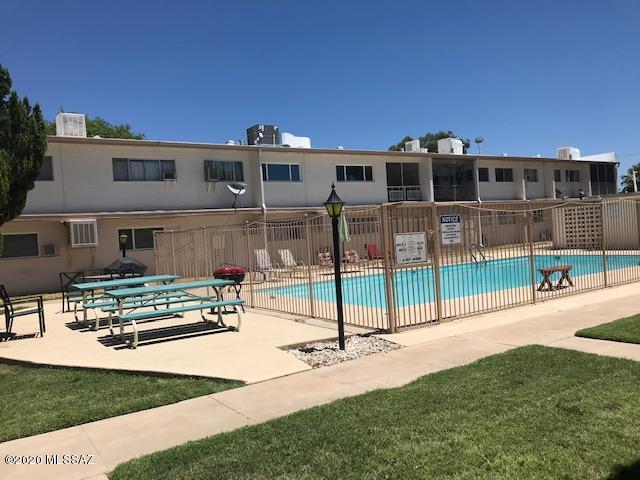 Enjoy the private patio facing the pool in the confort of your own bedroom! Recently painted, remodeled bathroom and roomy walk-in closet are some of the amenities you can enjoy in this well maintained small condo in the heart of Tucson!