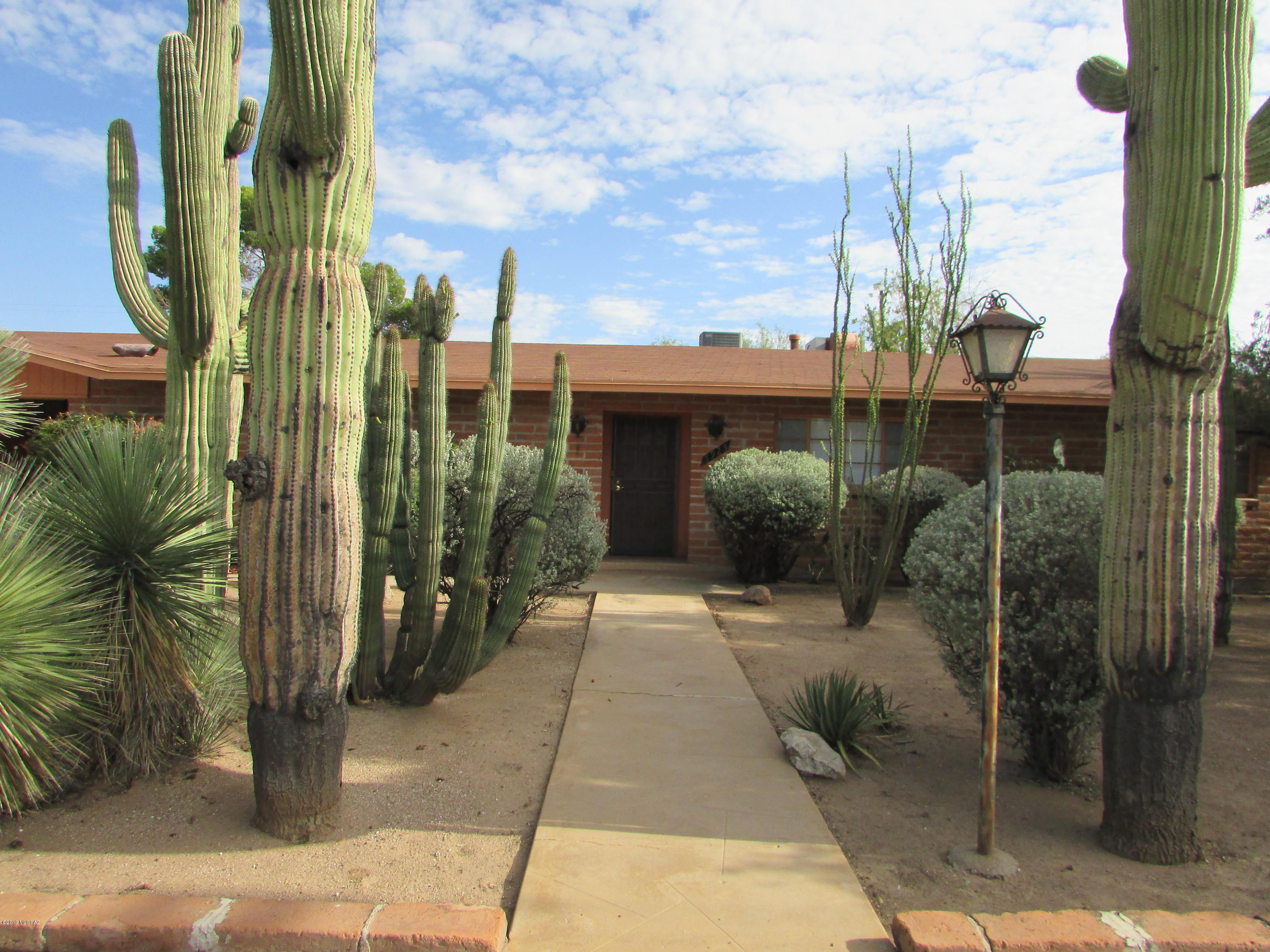 Built 1955, Beautiful, open & bright spacious 3Bdrm, 2Ba home, w/Casita workshop 684 square feet ''unfinished'' accessible from back yard, front yard garden of cactus, lots of character and charm, ceramic in living areas, carpeted bedrooms, A/C, Formal Living room with Fireplace, Formal Dining room area, large Galley kitchen with Refrigerator, Stove, Dishwasher, Lots of cabinets. Laundry room with Washer & Dryer hook-ups, Double carport with storage cabinets. Beautifully Landscaped walled back yard, (sheds are not available). Close to bus lines, shopping, Private & Public schools. Pet friendly/non-aggressive animals-Pet rent $25/mo per pet***$28 mandatory enrollment in Resident Benefit Package. Includes HVAC filter delivery, cable internet concierge services, and more! Ask agent for detail