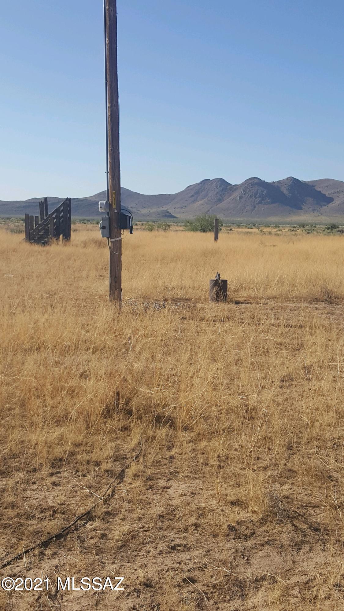 Mostly cleared, level, fronting on two county maintained roads,  Sulphur Springs Road is the north property alignment & Parker Ranch Road is the south property alignment.  New 6'' well drilled 2024. Five older 16'' irrigation wells, no water at current depth.    Natural gas  & three phase electric on Site.    Older house of no value has collapsed.  Neighbor to west is actively farming.   Great value for one of the few large contiguous parcels left in this area.