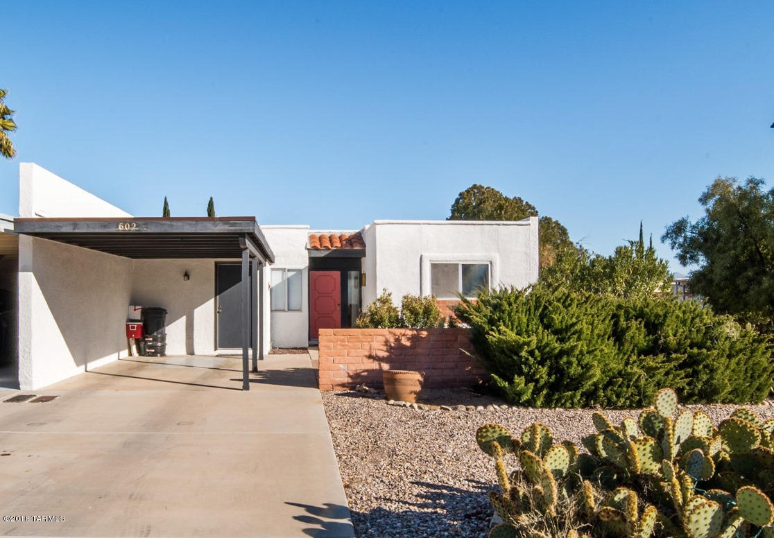 The simple life awaits you in this quaint townhome featuring a compact floorplan for low maintenance and easy care landscaping. Picture yourself enjoying breakfast in your brick paved courtyard. This home has beautiful floor tile in desert tan color tones for inspirational warmth. The “U” shaped kitchen design makes cooking a snap with abundant counter space and plenty of cabinetry. The oversized floor tile continues throughout the living room and dining area. Relax in your private backyard with its magical mountain views and kick back because this setting was designed for enjoying the natural desert and desert wildlife.