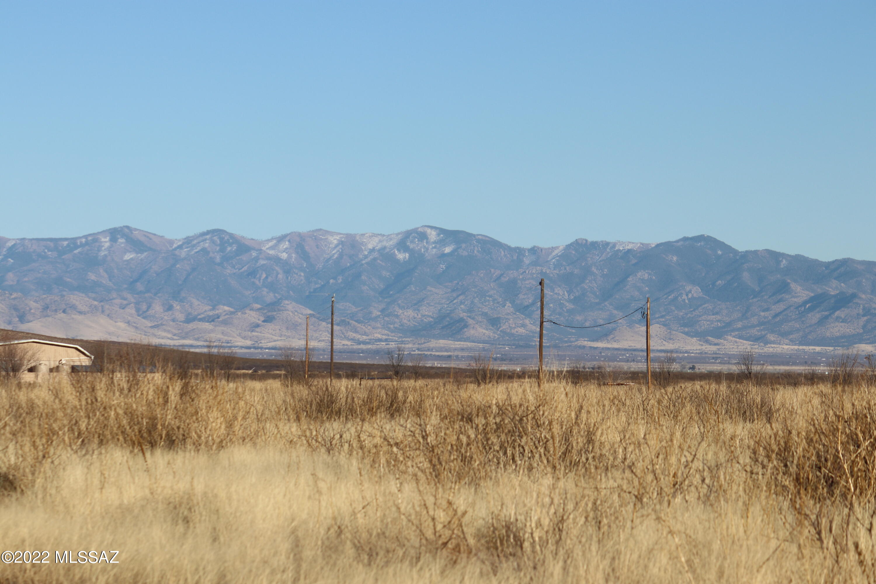 Scenic 4 acre lot on Kansas Settlement Rd in the Deer Haven Subdivision, Pearce AZ. Views of Cochise Stronghold in the Dragoon Mountains to the west. Views of the Chiricahua Mountains to the east. Electric along Kansas settlement Road. Shopping and medical care available 25 minutes away in Willcox. Enjoy local wine tasting. This area grows world renowned wine grapes and produces some of best wines in the USA.  Enjoy nature with abundant wildlife. Have fun days at local rodeos, festivals, and concerts. We have a limited number lots left. Don't miss out.