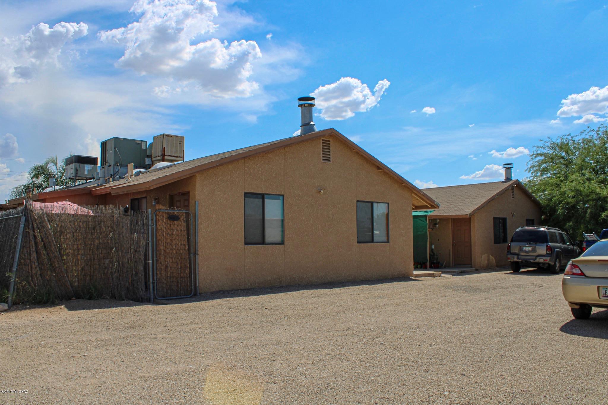 GREAT INVESTMENT/CENTAL LOCATION. Occupied spacious 3/2, heat pump, fireplace, each unit has outside laundry room/storage, fenced backyard & covered patio.  Plenty of off street parking, tenants pay untilites. Well maintained in great condition. Sale must include adjacent 1245/1255 mls # 21920151.  Close to downtown, U of A, shopping and restaurants. Call agent for showing instructions.