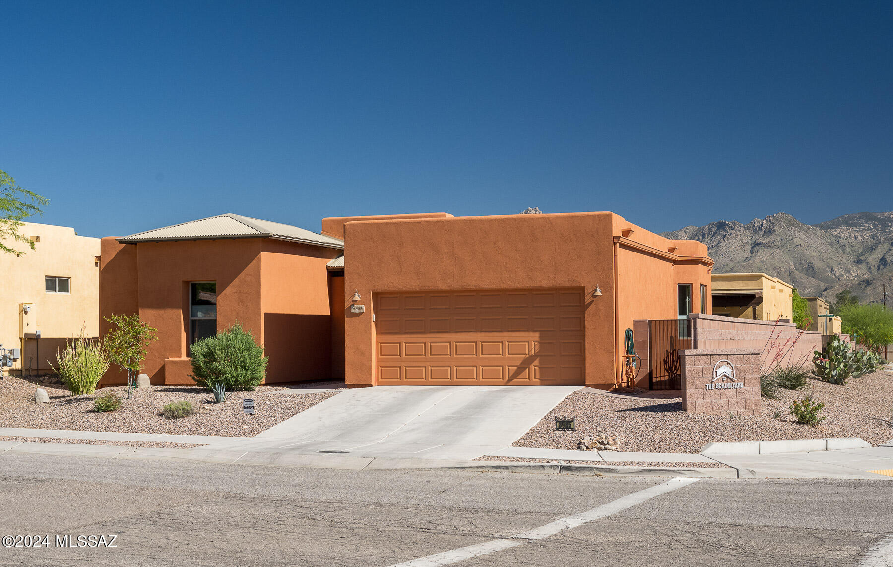 Range priced between $399,900 to $404,500.  With full priced offer, seller will give a $5,000 credit for you to use towards closing costs or rate buy down! 
Check out this 3 bed, 2 bath home in Tucson's Schoolyard subdivision. Built in 2017, it features an open layout flowing from bright living spaces to the eat-in kitchen.  Perfect for outdoor entertaining, it has a landscaped backyard with gorgeous views of the mountains from two sides. Upgrades include a re-coated roof & an extended two-car garage with a utility sink and electrical for a workbench. Eco-friendly, the home is plumbed for water harvesting. Enjoy community amenities such as a park and playground, enhancing your lifestyle!