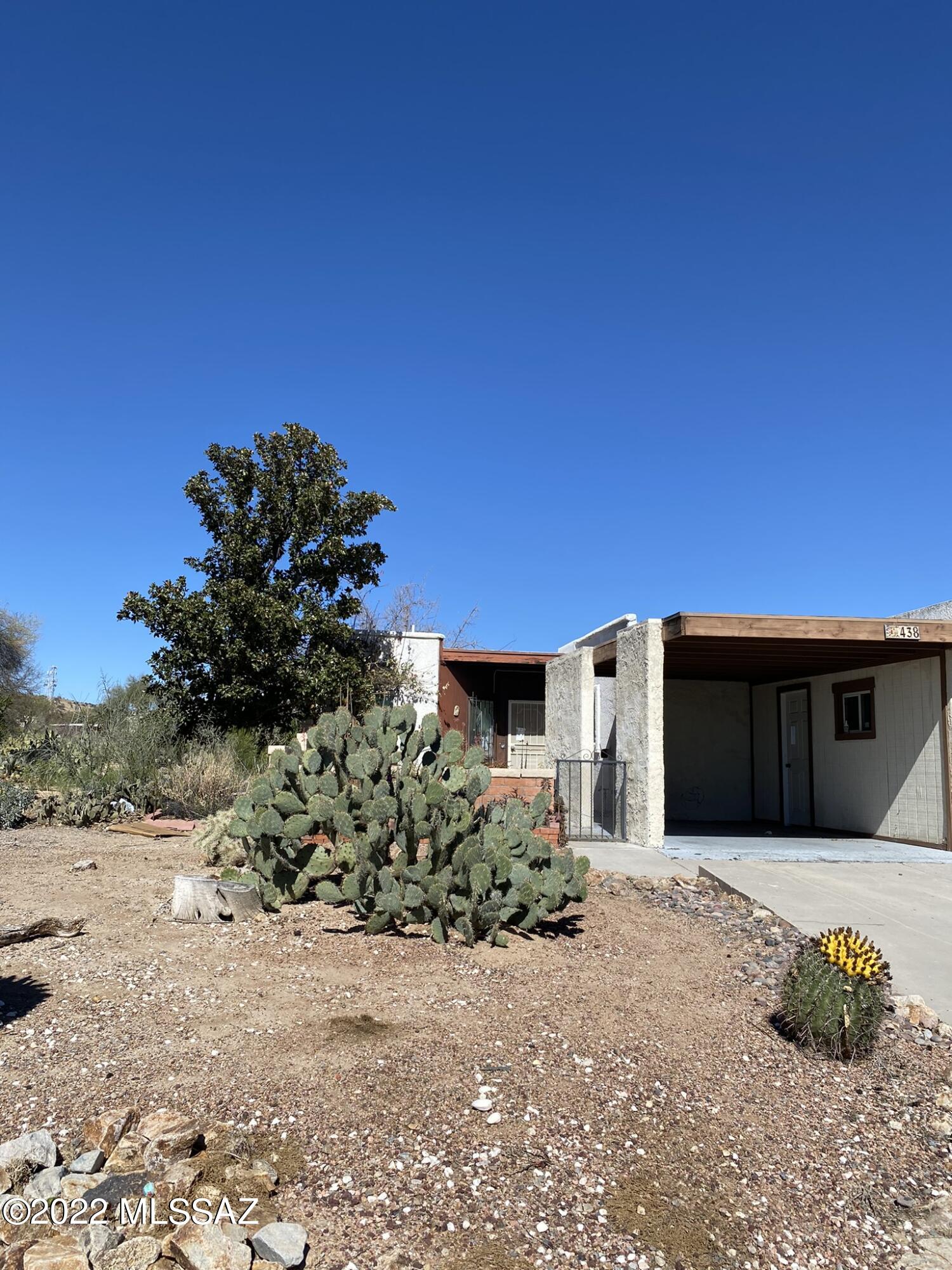 This townhouse located in Colonia De Los Alamos in Green Valley is age restricted as a 55+ community. It is also located in GVR area which offers lots of features if buyer decides to join. Property is in need of fix up and will convey in absolute AS IS condition but makes for a great investment opportunity and is priced accordingly. This TH has 2 bedrooms and 2 bathrooms with a spacious floor plan and small enclosed AZ room and yard plus extra storage space in carport added too which is a nice bonus. Home is located close to rec center, pool and  tennis courts. Lots of good potential here, don't miss out!