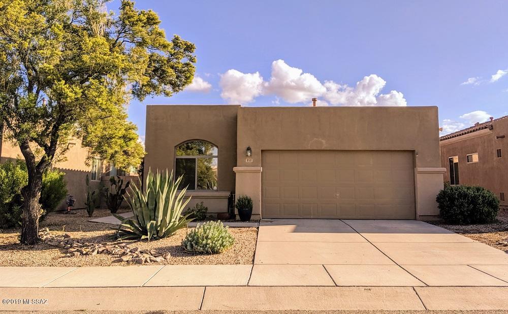 This 1483 sq foot Rancho Abrego single story home is right on the border of Sahuarita and Green Valley. Well maintained 3 bed, 2ba, 2 car garage with carpet in the bedrooms and beautiful cement overlay in the rest of the home. Sun sail structure allows for enjoyment in the landscaped backyard year round! Freeway accessible and shopping and dining within walking distance. HOA includes pool, basketball court and parks. You'll love the Ring doorbell and Nest thermostat. Easy showing! Call LA for an appointment.