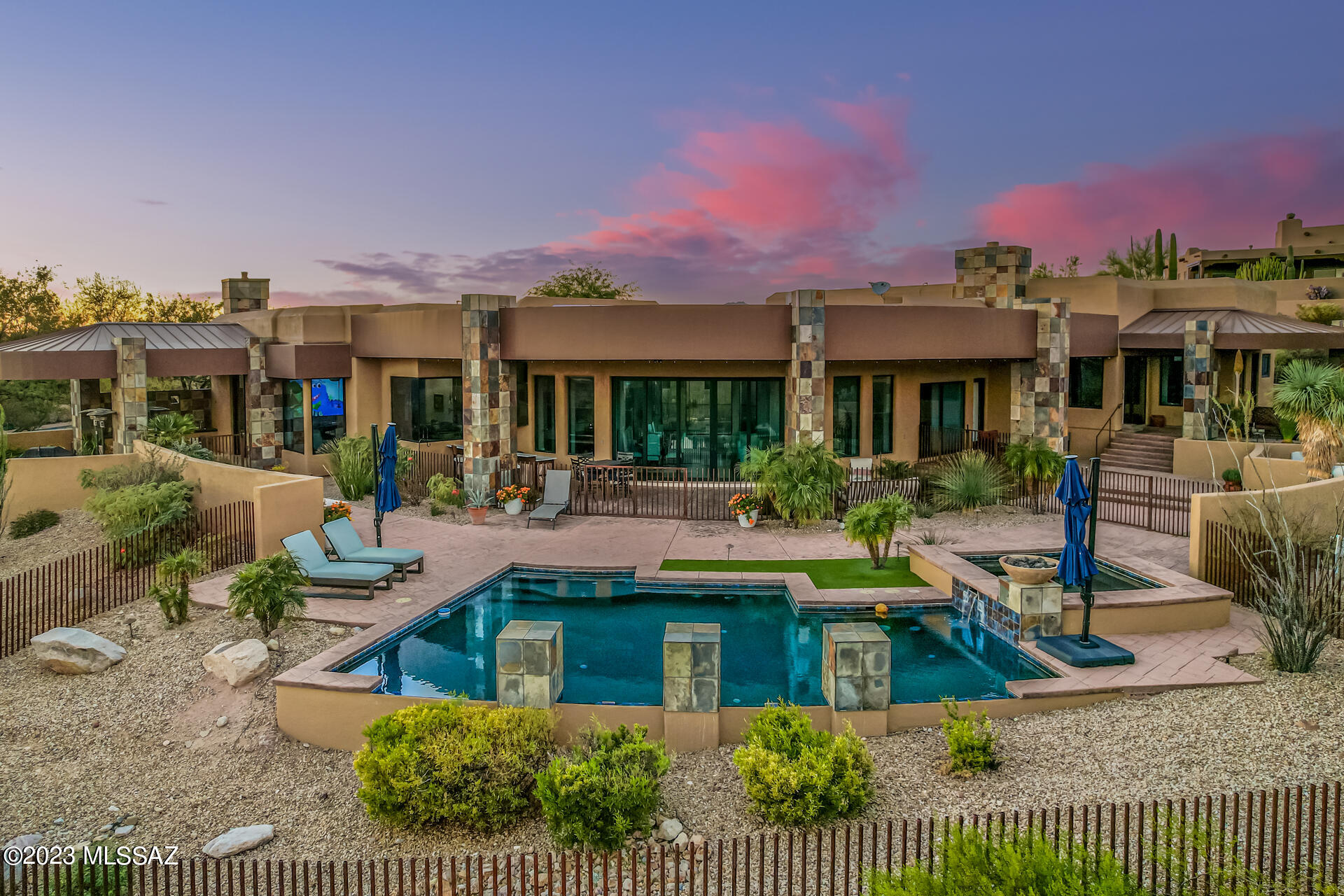 1+ acre 4757 SF grandeur home located in Coyote Ridge Subdivision with a perfect floorplan/layout. One of the best Panoramic city and mountain views throughout. Gated courtyard with fountain. Outdoor bar with 3 beer taps & TVs. Floor to ceiling curved glass sliding door in living room with 24 ft radius, open floor plan, cherry wood flooring, Chef's kitchen with SS appliances, marble island with accent counters, bar seating, & butler's pantry with150 bottle wine refrig. Master bedroom includes large spa-like tub & built in Miele coffee maker. A must see home.