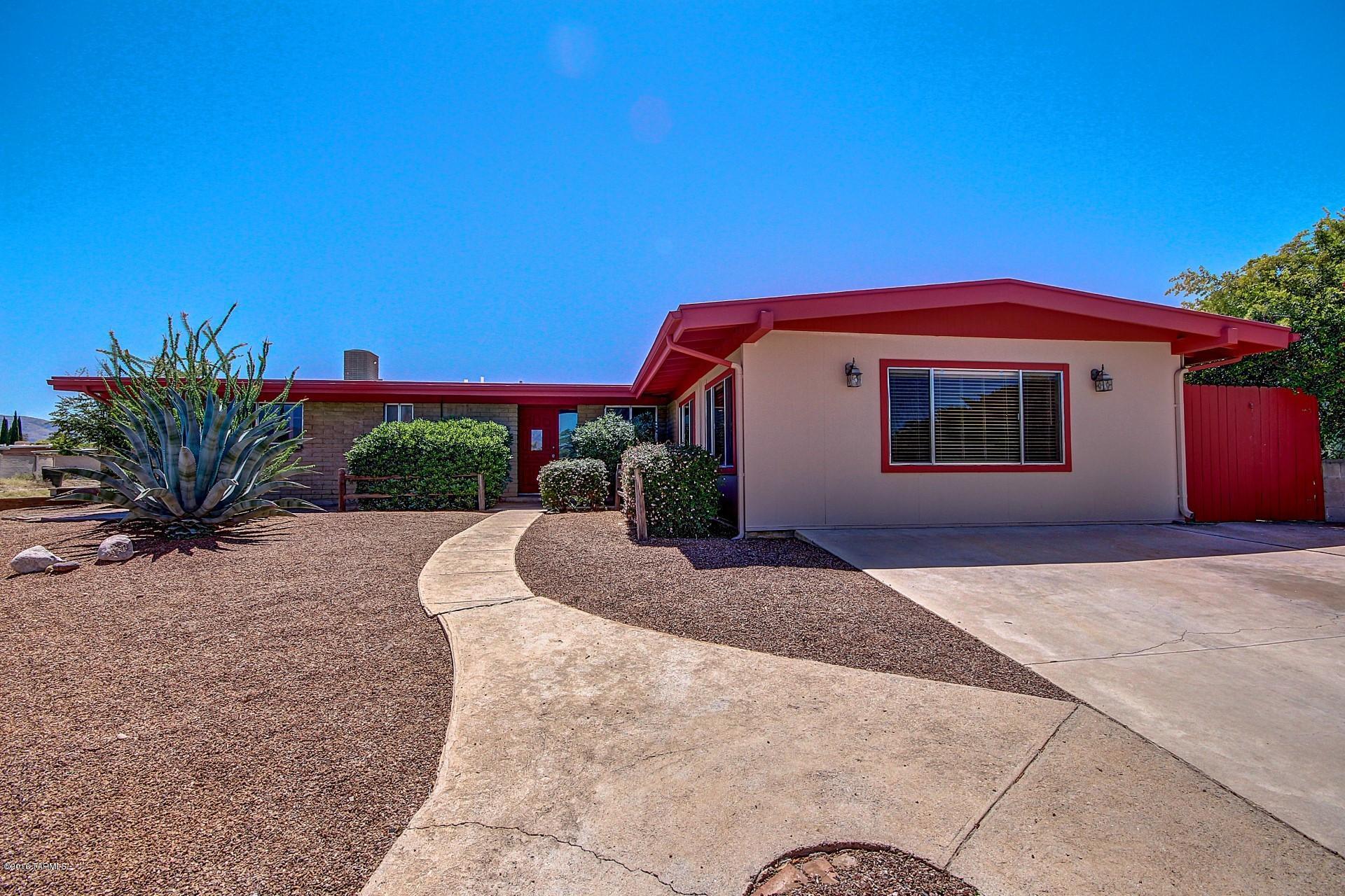 Newly renovated home in the Estes Park community of East Tucson! Tons of living space with designer paint, plush carpeting, and tile flooring in all the right places. Two cozy fireplaces that will keep you warm during the brisk desert winters. Eat in kitchen offers custom cabinets, black appliances, and unique tile counters and back splash! Three spacious bedrooms, master bedroom has adjoining bath. Generous backyard is complete with an extended covered patio and low care desert landscape. This home is ready for your personal touches! See it today before it's gone!