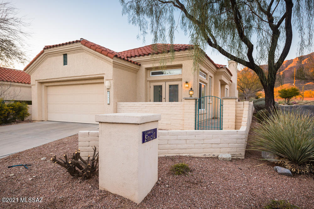 Exceptional home situated on premier corner lot in coveted La Paloma/Vista Serena! This remarkable home boasts a highly desirable floor plan as master quarters are located on the bottom floor! Features include soaring vaulted ceilings, exquisite slate/red wood/travertine flooring, wood stairway banister, gas fireplace with slate trim, canned lighting, custom cabinets/countertops, spacious walk-in closets, dual vanities in master bath, travertine walk in shower, downstairs guest half bathroom built in bar, laundry room, and premier stainless steel appliances! Exterior features tile roofing, side gated entryway, front and back patios, built in flagstone/brick pavers, established fruit trees/vegetation with irrigation, (see more)... ...concrete front driveway, stone fountain, large two car garage, and remarkable views of the Catalina Foothills! Truly pride of ownership at its finest! District 15/Catalina Foothills! Furniture and personal property available for sale via separate bill of sale!