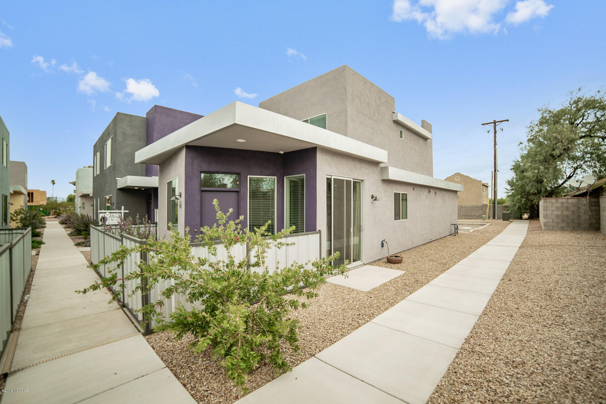 Tucson's Park Modern community. Unique opportunity to own one of the few DETACHED Modern loft style architecturally unique homes. Built by Pepper Viner Homes. 2 Master Bedrooms with En suites plus a downstairs powder room. An open floor plan that is perfect for entertaining. The eat-in kitchen boasts of SS appliances, gas range, tiled back splash, double sink, dishwasher, built-in microwave & Quartz countertops. Ceiling fans in all rooms. Ceramic tile, wood look vinyl planks and carpet flooring. Dual Pane Windows, alarm system & Central Air. Located near U of A, restaurants, entertainment & downtown. Get into this limited Park Modern for thousands less than a new build... Schedule a showing now, this home will not last!