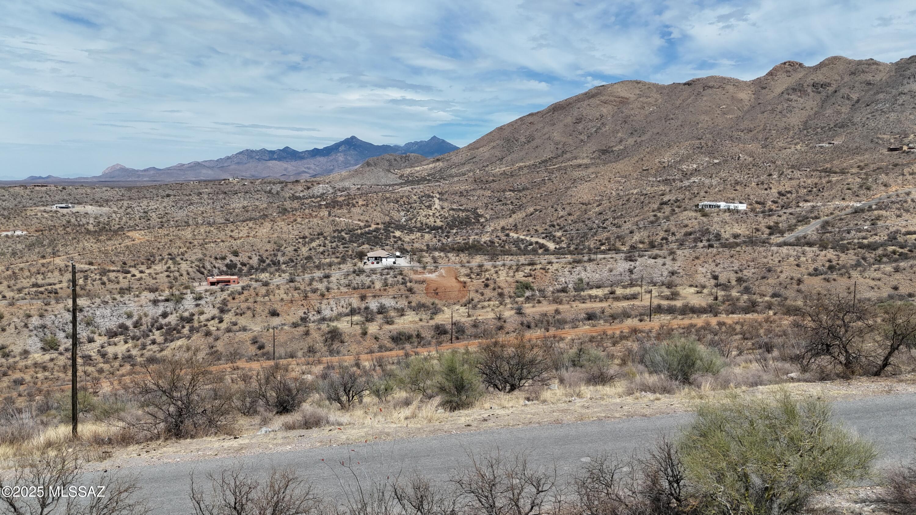 Great location with quick easy access to Pendleton and Interstate 19.  All paved.  Electric at the street.  Many houses along Camino Esturion so there is a water line in the street so it's a matter of purchasing a water tap to get service when you build.
The lot has a downhill slope which is why it is priced accordingly instead of $20,000 it is $8,900.