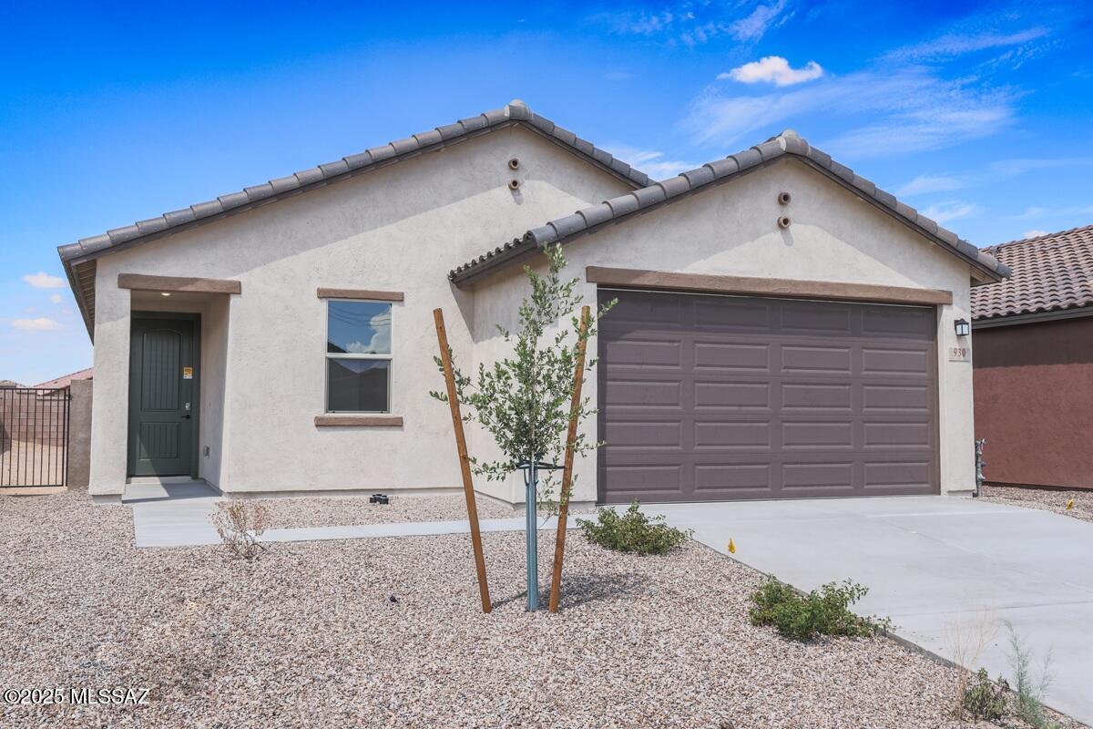 This home is open for self-guided tours daily 8 am - 8 pm. This charming, single-story home showcases an open floor plan with 9-ft. ceilings and sleek porcelain tile flooring throughout. The kitchen boasts an island, granite countertops and Whirlpool® stainless steel appliances. Relax in the primary bedroom, which features a spacious walk-in closet and connecting bath that offers a walk-in shower and dual-sink vanity. Step outside to the covered back patio and enjoy seamless indoor/outdoor living in this stunning home. Price includes discount predicated on using seller's preferred lender KBHS.