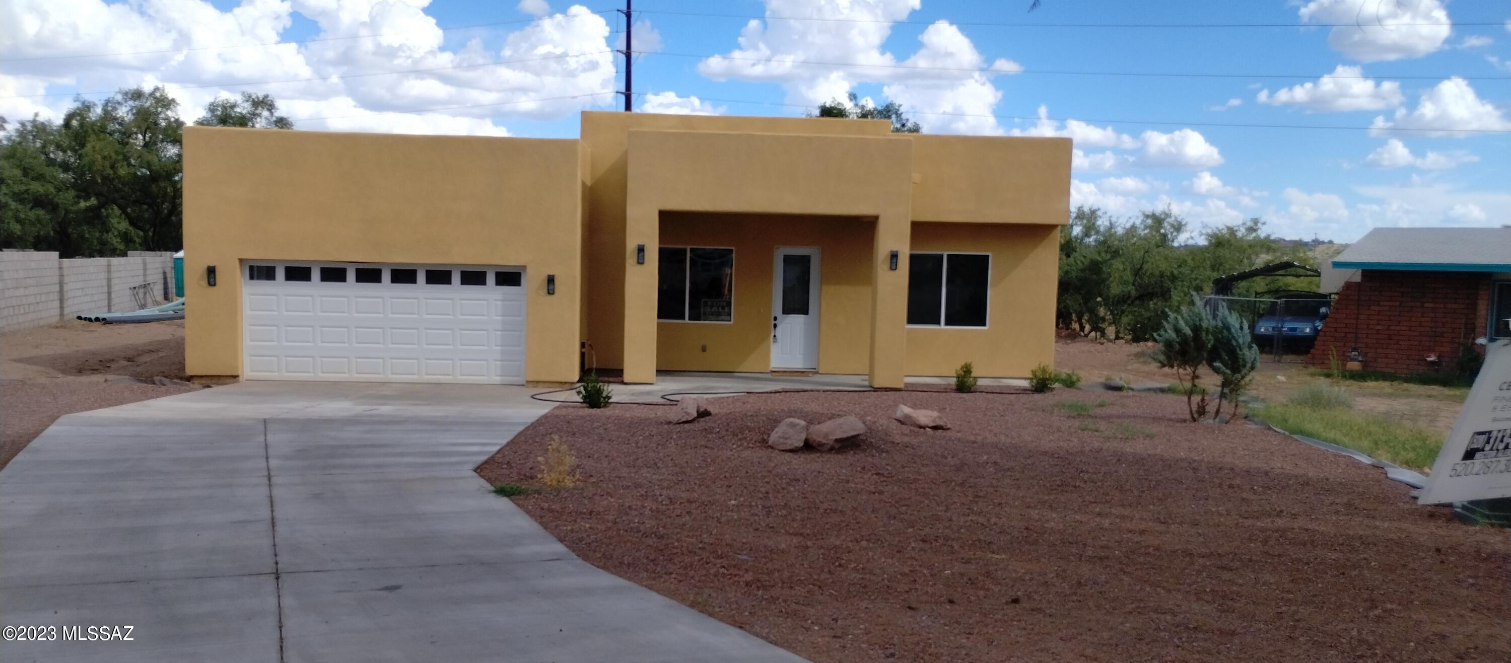 BEAUTIFUL NEW CONSTRUCTION. 
With 2000 sq ft . living space 
3 BEDROOMS, 2 BATHROOMS, 2 CAR GARAGE.
You will love the open floor plan.
Granite counter tops throughout with dual sinks 
Spacious kitchen with custom cabinetry.
Title flooring throughout the house master bedroom with a large walking closet.
Located minutes away from I-19 for easy access to Nogales or Tucson. 
COME SEE THIS HOME TODAY...