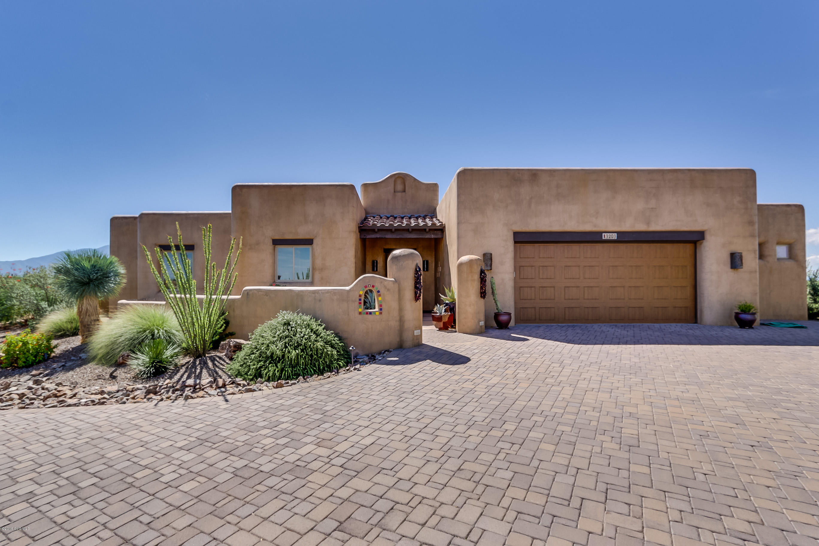 This exquisite home is high quality and built by Gary Cooper, considered a top builder in the Green Valley area. It has unobstructed views of the Santa Rita Mountains, Madera Canyon, Elephant Head, and more. In 2010 the owners paid $828,000 for the land, incredible house, beautiful pool and spa and all that is included. At $598,999 it is a steal! This symbol of your success features polished concrete flooring, Gourmet kitchen featuring a gas range with a 6 burner and griddle cooktop w/electric double steam assist ovens. 4' X 8' island w/stainless steel counter top & integrated sink.All doors and cabinets are solid hand finished knotty Alder. Over 2,000 SF of covered patio that features full kitchen w/granite counter tops. Air conditioned workshop off of garage. Views from every room. Hur