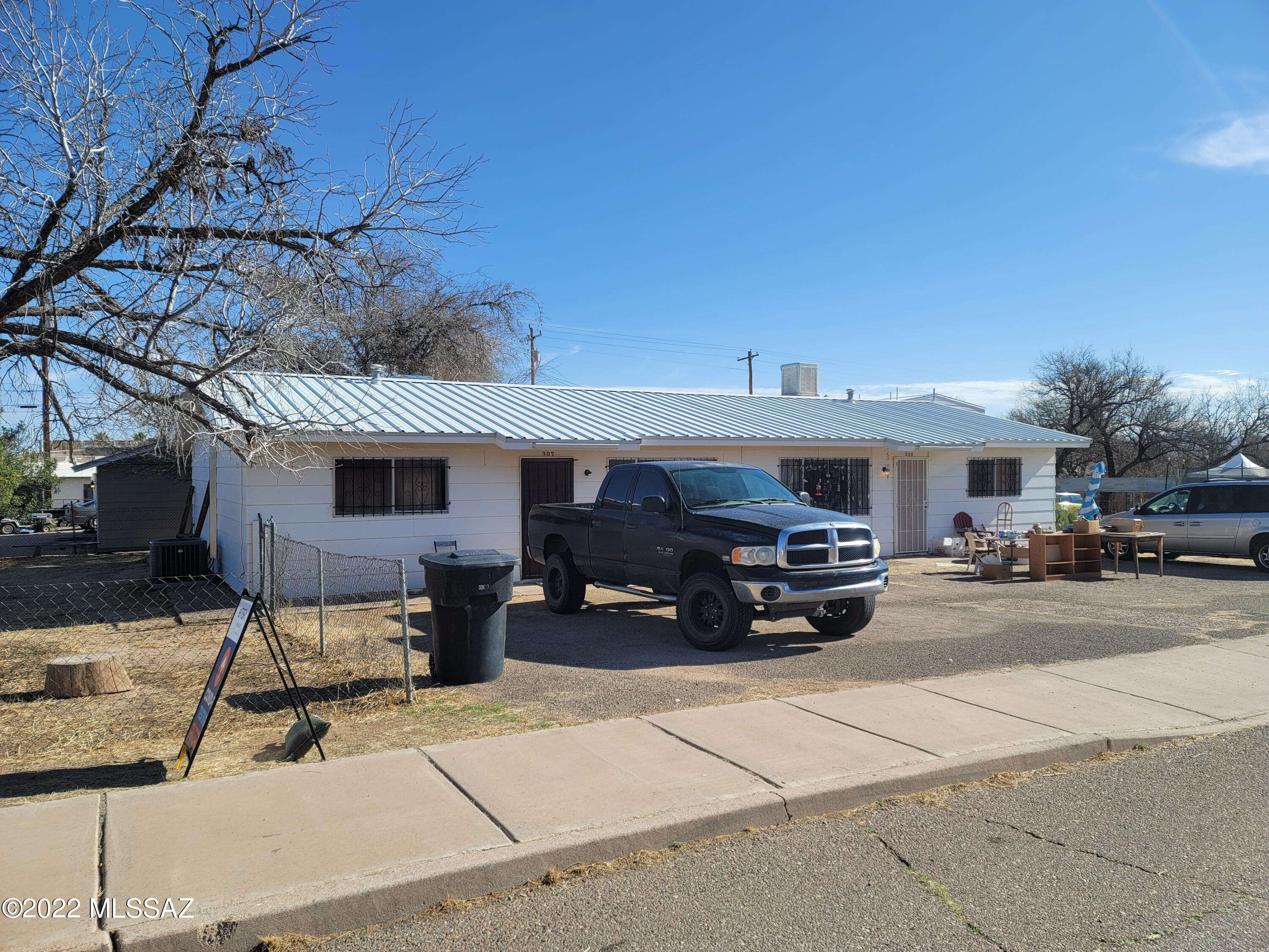 Duplex in Benson! Each unit has 2 bedrooms and 1 bathroom! The complete unit has a newer metal roof. One unit has been remodeled with flooring and A/C. The other unit has tile floors. Both units are in very good shape and currently rented month to month. Move in one and rent out the other to help with your mortgage or rent out both to create some cash flow! Units are currently rented for $700 a month.  Cash or conventional loans only. Operating expenses can vary and shall be determined by the buyer during the inspection period.