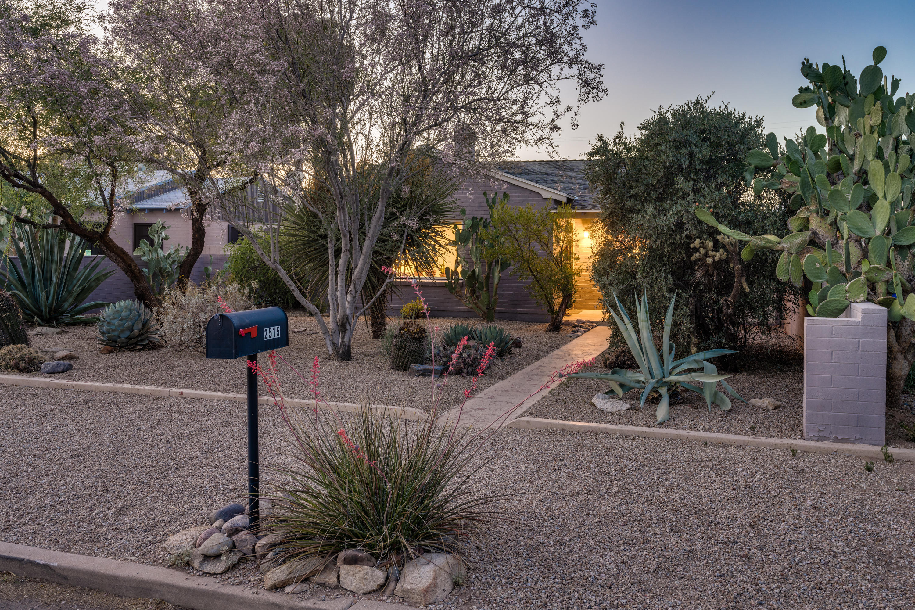 Fantastic bungalow in prime central location of Blenman Elm! A perfect combination of modern updates & historic make this home comfortable, functional & stylish, both inside & out. Beautifully remodeled kitchen for max function & design w/wood cabinetry, SS appliance & quartz counters, complete w/breakfast bar, all open to living areas. Recessed lighting, new windows & concrete floors in living & dining rooms offer a bright space that flows seamlessly for entertaining & every day.  The yard is a true extension of the living area, w/mature trees, including fig & citrus, thoughtful landscaping & gorgeous ramada. An oasis in the middle of town! Big yard, w/lots of room to add-on. Updated PEX water lines, HVAC & water heater in past 5 years. This is classic central Tucson living at its finest!