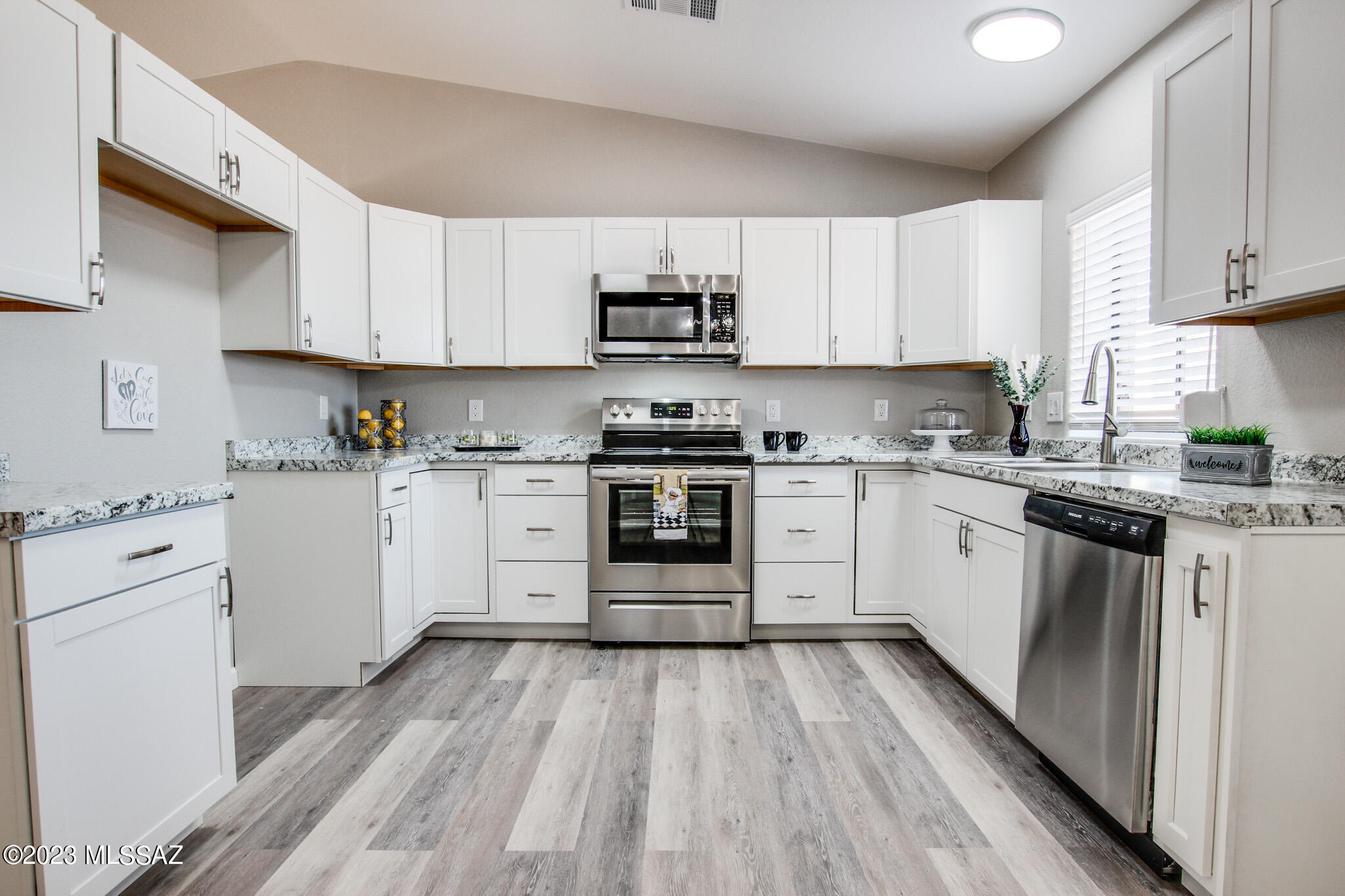 Located in Kennedy Park Estates and resting in a quiet cul de sac, is this Wonderfully Updated 3 bedroom 2 bathroom home! Open and filled with natural light, with all New flooring and Fixtures. Features include a gorgeous modern kitchen, SS appliances and ample cabinet space. Huge laundry room with extra storage space. Enjoy the views from the spacious backyard with pavers and no rear neighbors. Roll-A-Sheild Shutters installed on every window and they not only provide security and privacy but also can aid in energy savings. Close to park, schools, shopping and so much more. Come make this your home.