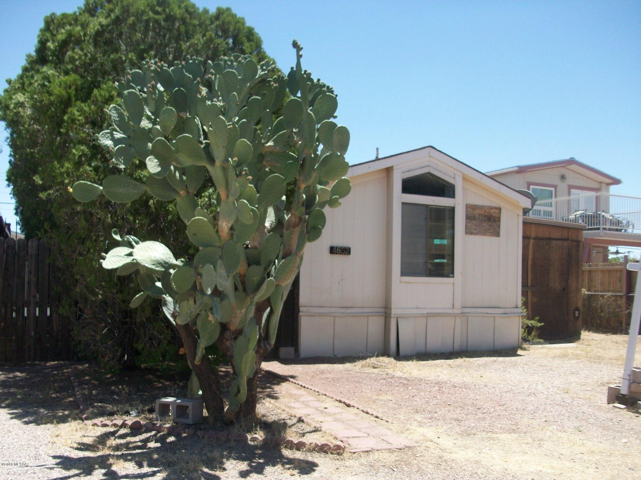 Great fix up investment opportunity. Priced for quick sale. Site built garage/workshop 696 sq ft with plumbed out 1/2 bath - gates, concrete pads, storage (addition 440 sq ft) - unaffixed 2 bd, 2ba singlewide Mfg Home - convenient location. Consider this vacant land with improvements - Mfg Home can be taken out or buyer can apply for abandoned title/affixture.