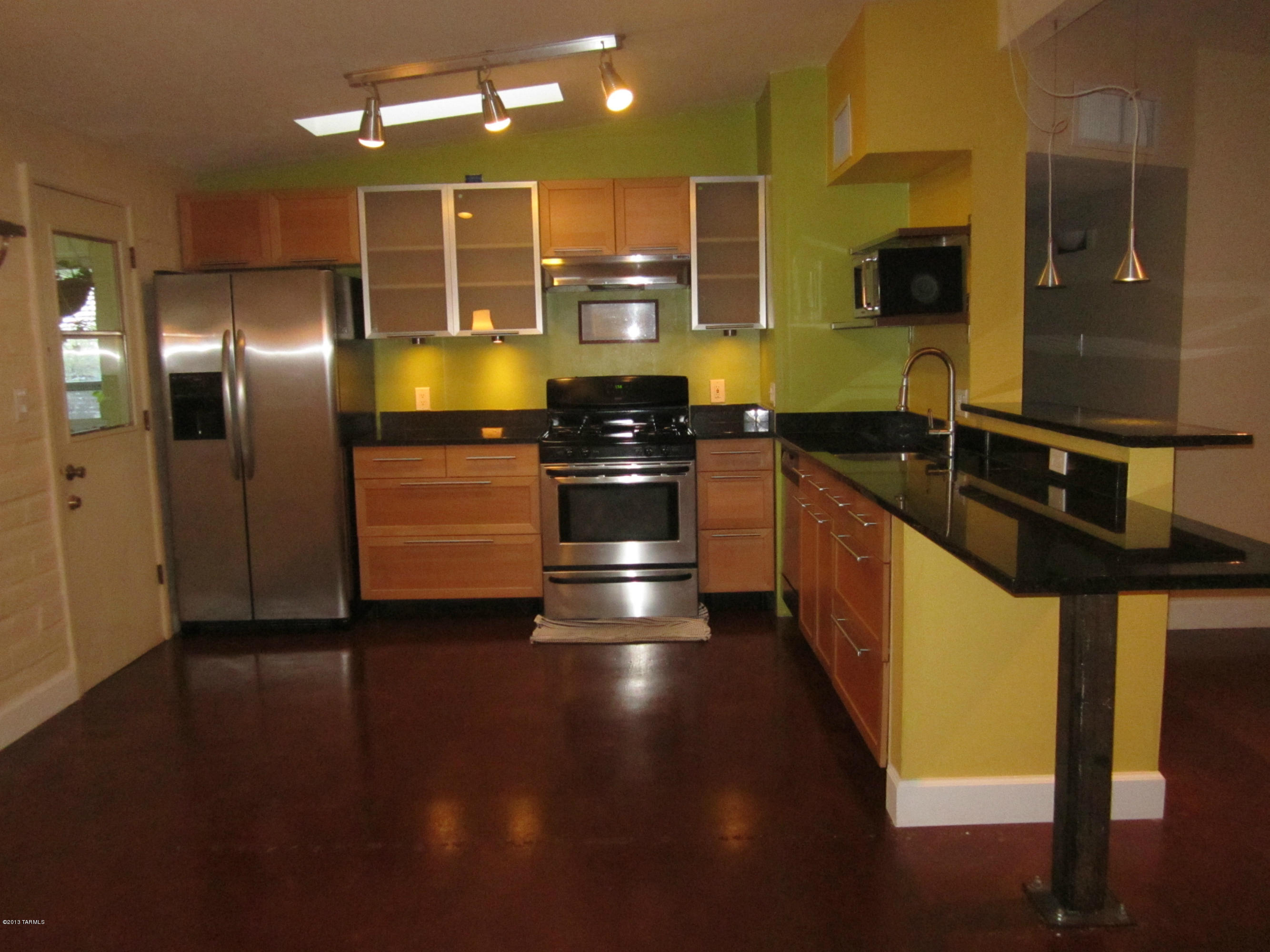 Charming 1960s brick 3BR 1 1/2 bathroom home with updated kitchen and bathrooms!Office/den area off the kitchen area, kitchen with granite counters, stainless appliances and gas range, which opens up to living room. Painted concrete floors and accent walls make this house feel like home. Huge rear yard with built in brick BBQ. Walking distance to 2 bus lines. Very close to shopping and only minutes to the U of A. Dual cooling, however evap in ''as is'' condition.

**tenant occupied till 04/30/2021**