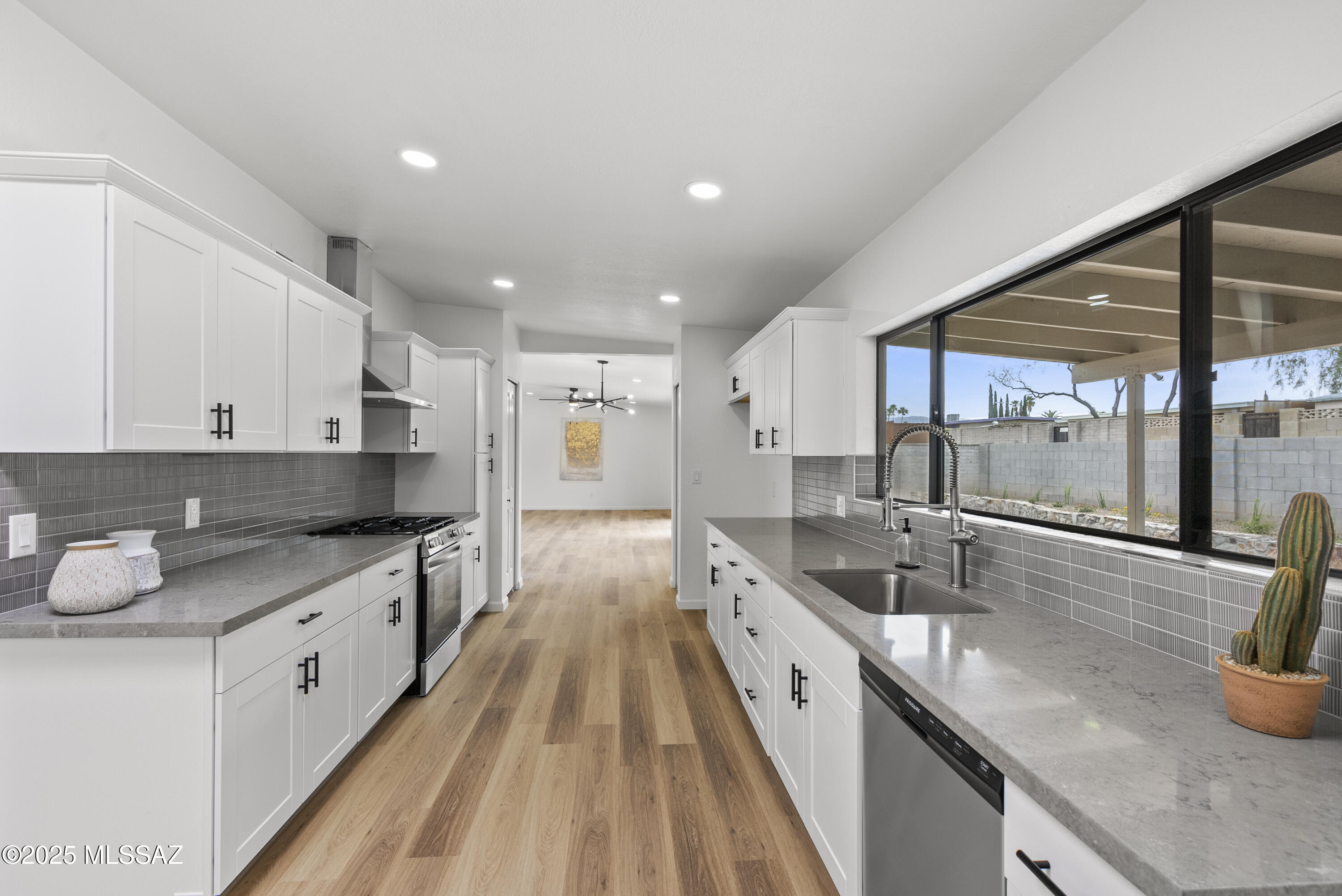 Sleek & Modern Ranch-Style Retreat with Pool & RV Parking
Step into this stunningly updated 5-bedroom, 2.5-bathroom ranch-style home, where modern elegance meets spacious comfort. Thoughtfully renovated with a designer's touch, this home features light wood vinyl plank flooring, soft white walls, and an open-concept layout that exudes warmth and sophistication.
The heart of the home—the kitchen—boasts gorgeous quartz countertops, a beautifully designed backsplash, and sleek finishes, making it both stylish and functional. The spacious primary suite is a true retreat, complete with a large walk-in closet, and a spa-like ensuite bathroom featuring a dual vanity and a walk-in shower designed for ultimate relaxation. Step outside to your private backyard oasis, featuring a newly replastered pool and a fully landscaped yard with turf, perfect for effortless entertaining. The large front yard is designed for low-maintenance living, while the wide lot provides ample space for additional parking or RV storage. A new two-car garage with extra storage adds even more convenience.
Located close to Udall Park, shopping, dining, and everyday conveniences, this modern ranch-style gem offers the perfect blend of style, space, and functionality. Don't miss your chance to call this home!