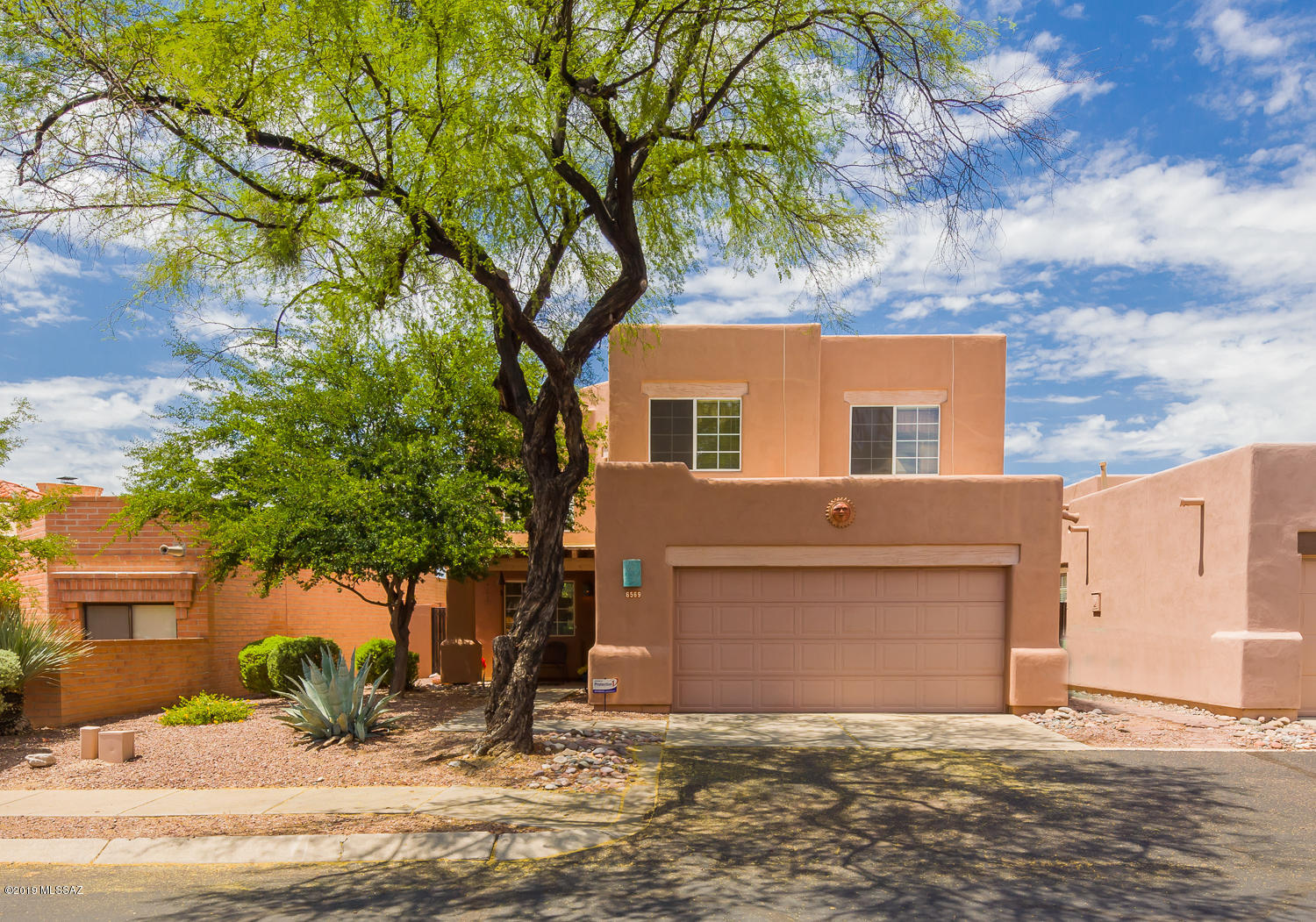 Stunning views and upscale living in this spacious Sierra Catalina Estates home! Enjoy soaring ceilings, neutral tones, and smart flow in this 4 bed, 3 bath. Beautifully updated kitchen with large single basin sink, rich granite, and new appliances. Full bed and bath downstairs, and updated flooring on second story. Updated bathroom counter tops, dual closets in master, and panoramic views off the master balcony. Take in our famous Tucson sunsets with an unobstructed desert landscape backdrop- no neighbors behind! Nicely landscaped backyard with recently replaced irrigation system. Perfect location convenient to shopping, great schools, and more. HOA includes community pool, spa, garbage collection, and street maintenance. Don't miss this fleeting opportunity.
