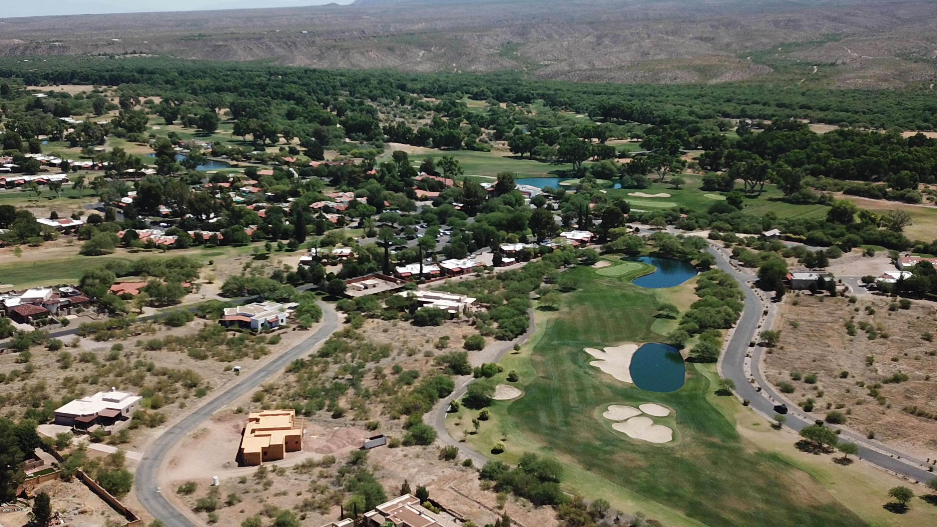 Fabulous mountain and golf course views from this Tubac Golf Resort (approx 1/2 acre) lot #10 in Unit 1, residing midway down hole 5 of the Anza Golf Course at the Tubac Golf Resort. The building site is set back from the fairway and offers paved streets and utilities (Epcor water, sewer, electric, natural gas, phone) to lot line.   See plat in photos and documents for lot location.